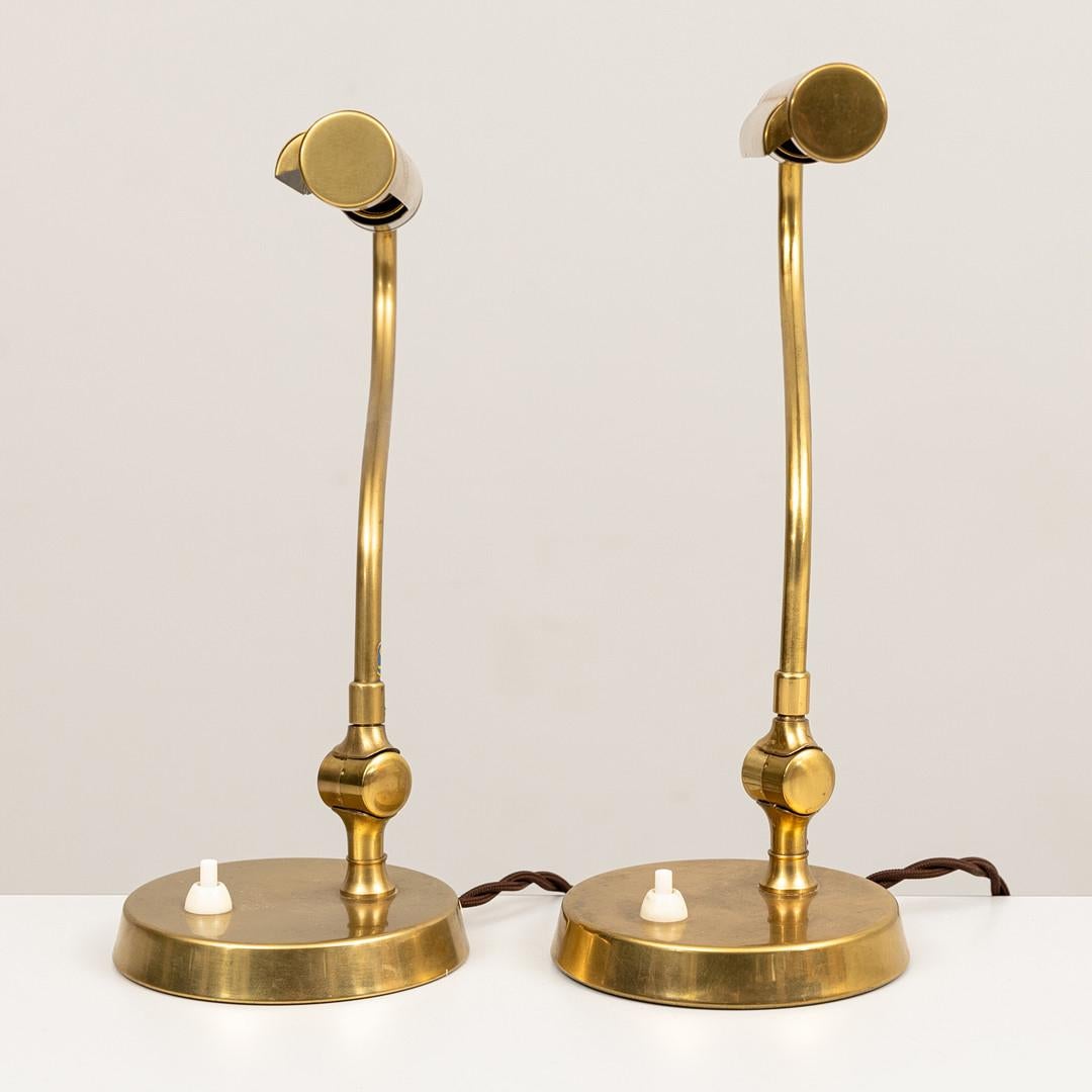 A pair of model 52435 table lamps by Uppsala Armaturfabrik.  The lamp in patinated brass with adjustable gooseneck and original base with switch. Circa 1930, price includes new wiring. Can be sold individually.