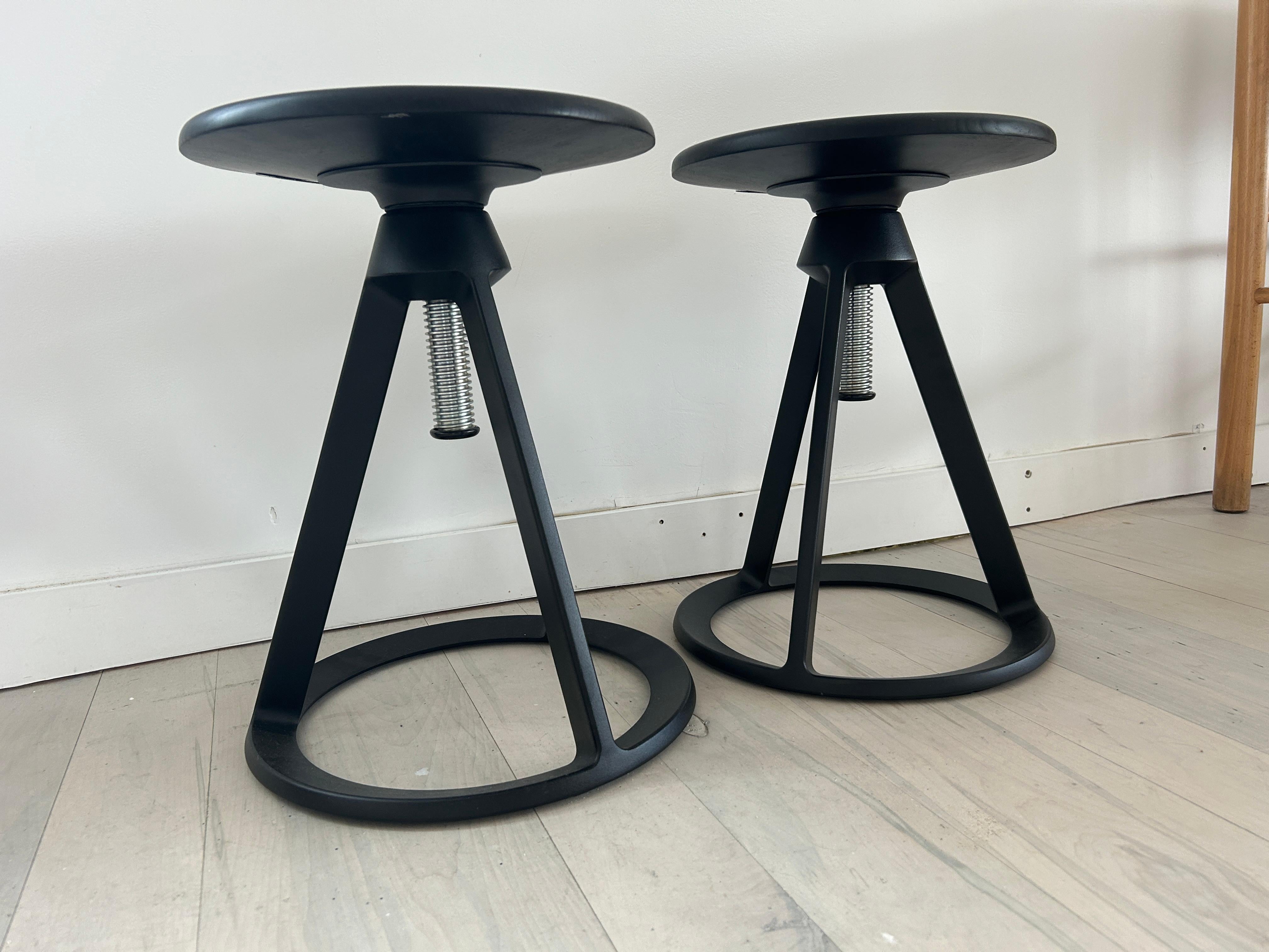 A pair of Modern Edward Barber and Jay Osgerby for Knoll Piton stools in Black.

Piton is a perfect pull-up option or full-time dining chair. The swiveling hardwood seat sits atop a cast-aluminum, powder coated base which is a unique