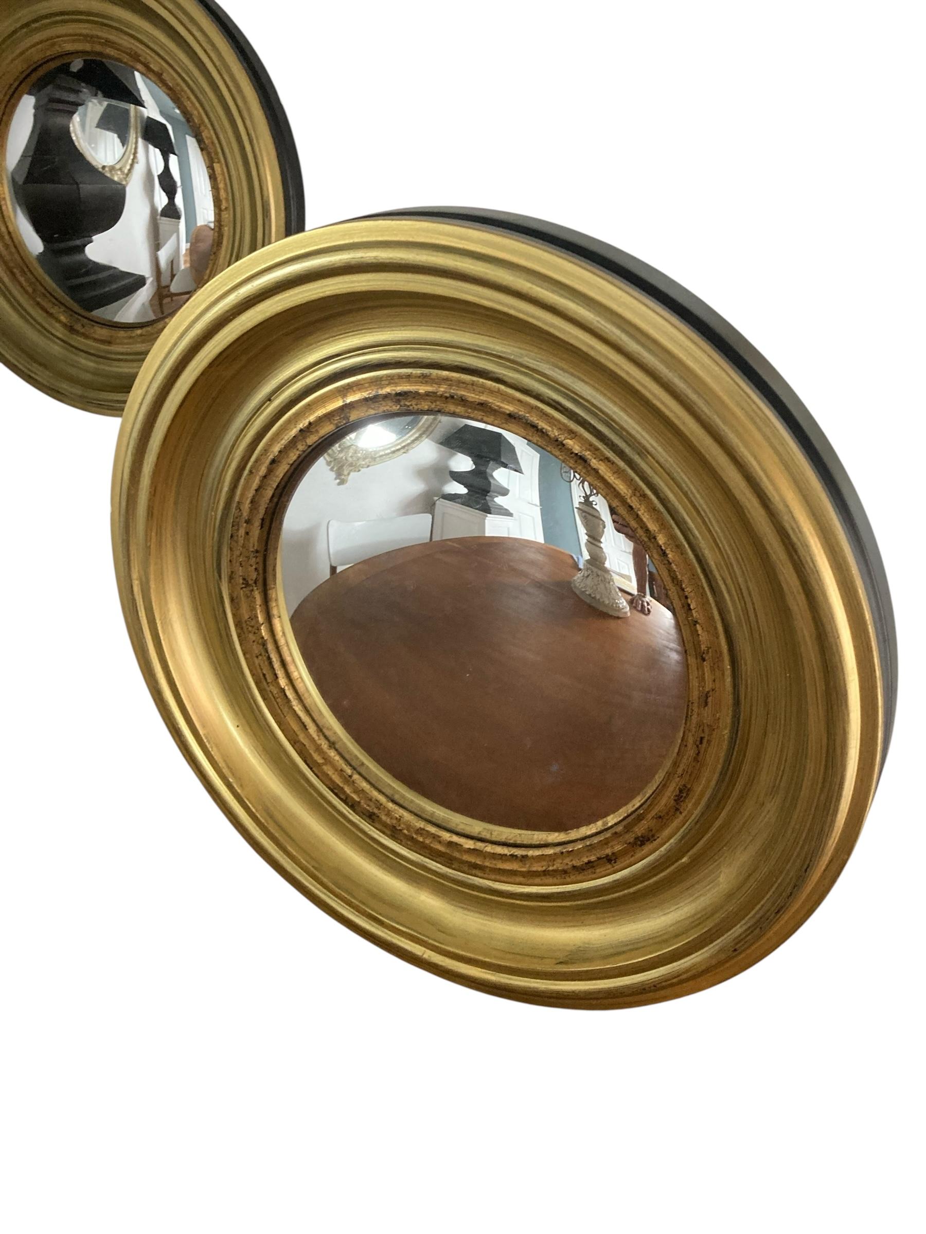 A Pair of Modern Regency Style Gold Circular Convex Mirrors with ebonsied Rim For Sale 6