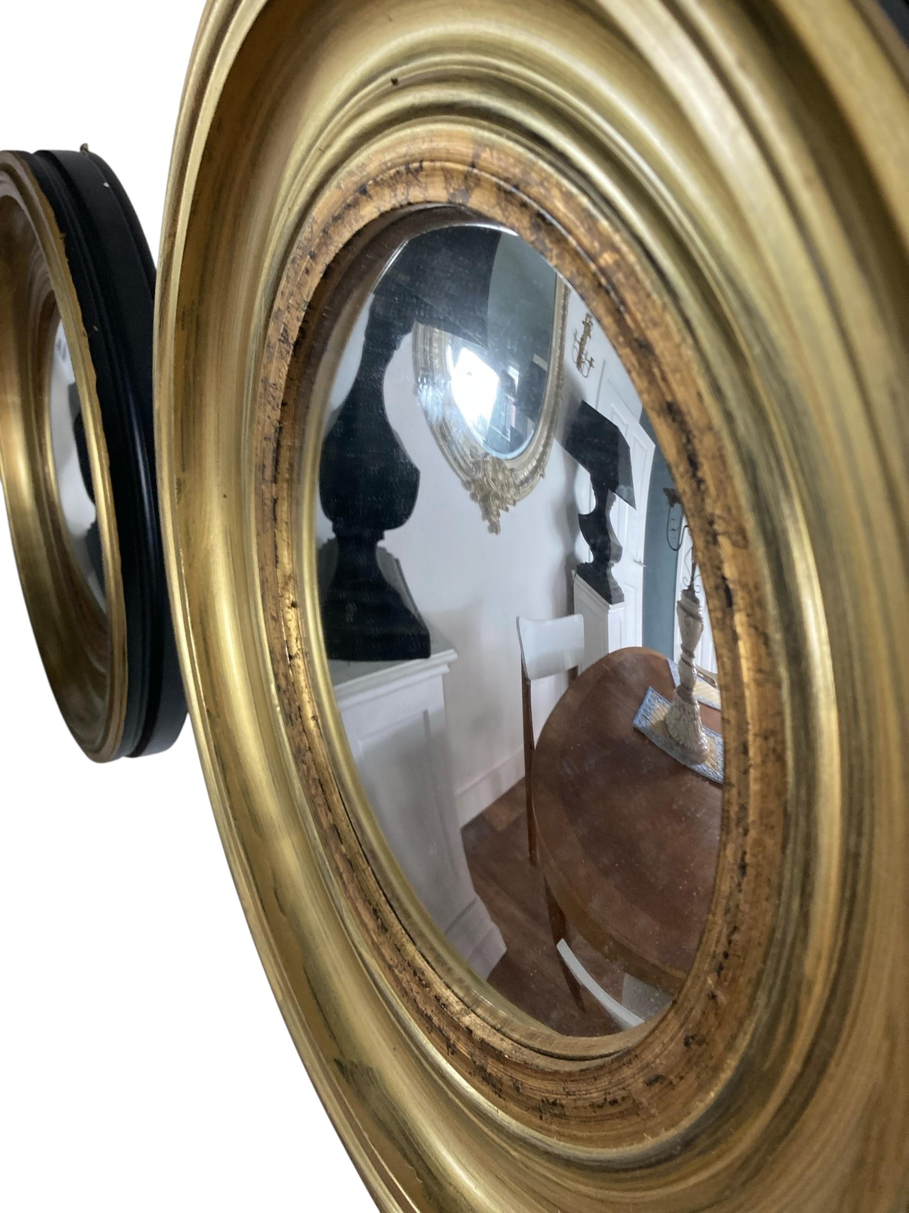 Wood A Pair of Modern Regency Style Gold Circular Convex Mirrors with ebonsied Rim For Sale