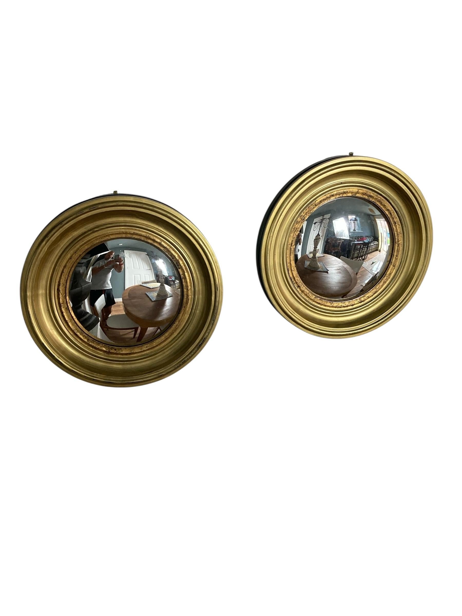 A Pair of Modern Regency Style Gold Circular Convex Mirrors with ebonsied Rim For Sale 2
