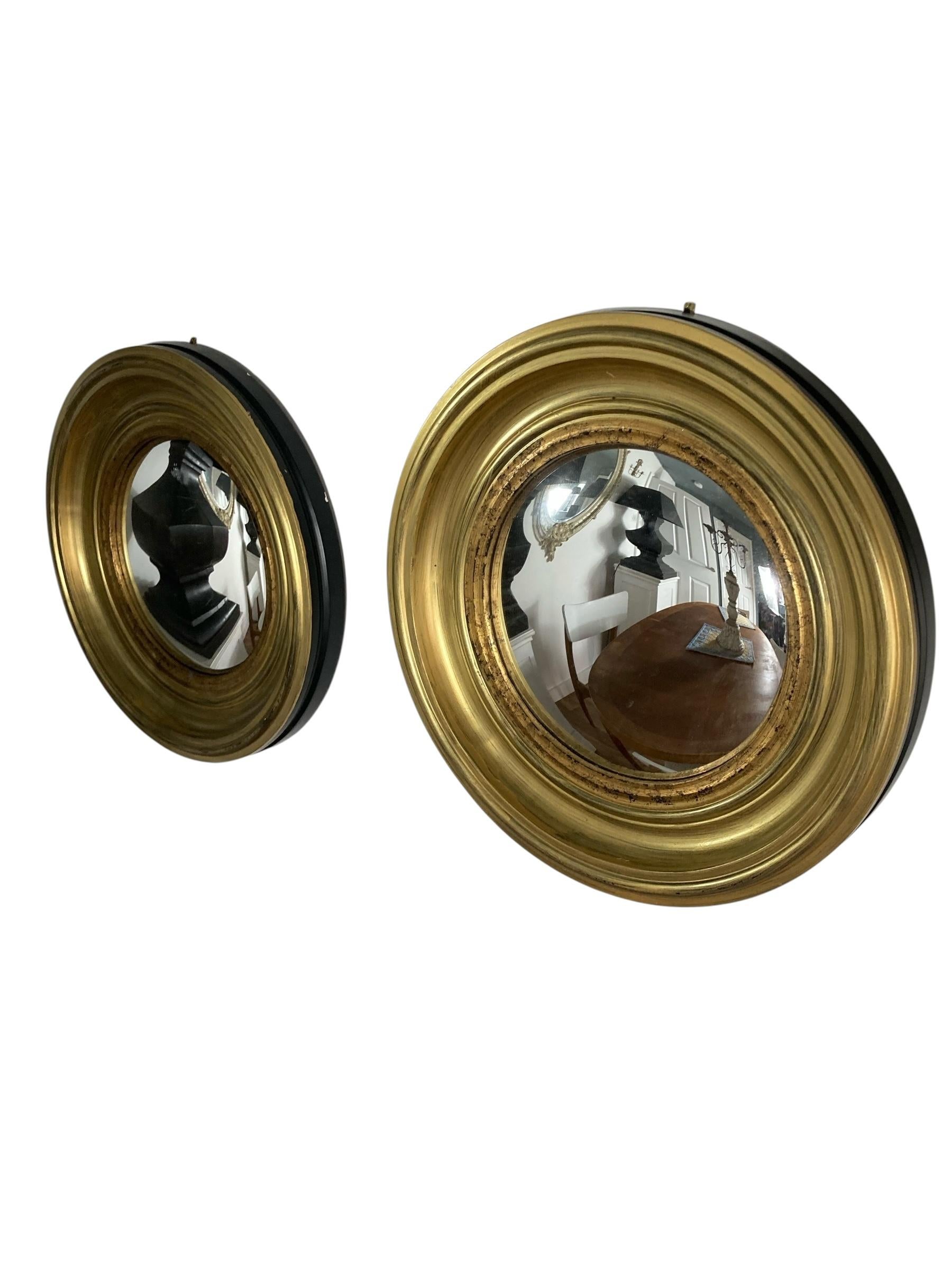 A Pair of Modern Regency Style Gold Circular Convex Mirrors with ebonsied Rim For Sale 3