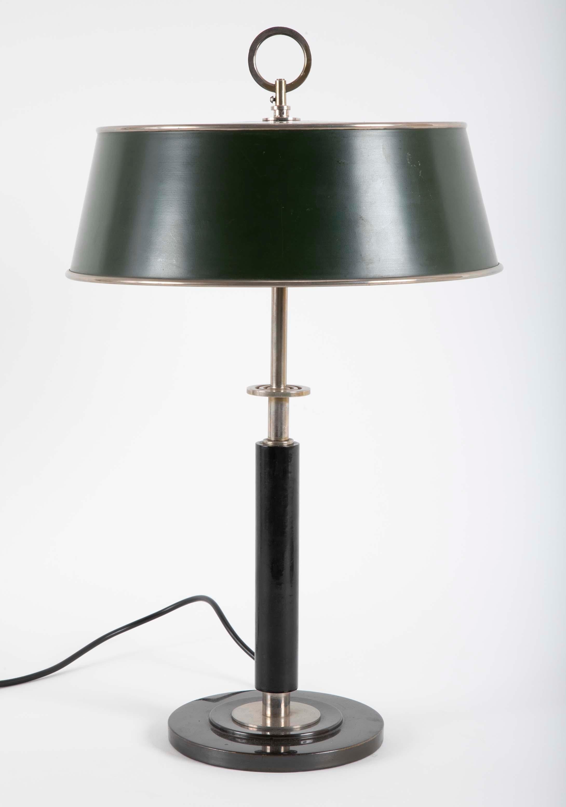 Model no. 27524 lamp designed by Erik Tidstrand manufactured by AB Nordiska Kompaniet, circa 1932. The lamp is nickel-plated metal, painted metal and painted wood. The underside indistinctly impressed.

Provenance: 
Nordic, Philips London, October