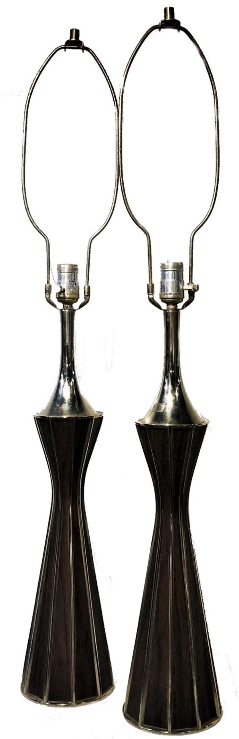 American Mid-Century Modernism
A Pair of Lamps
in Mastercraft Style 
Brass and Wood 
ca. 1960s

ABOUT
Mastercraft was founded in Grand Rapids, Michigan in 1946 by brothers Charles and William Doezema-who came from a family of cabinet makers. The