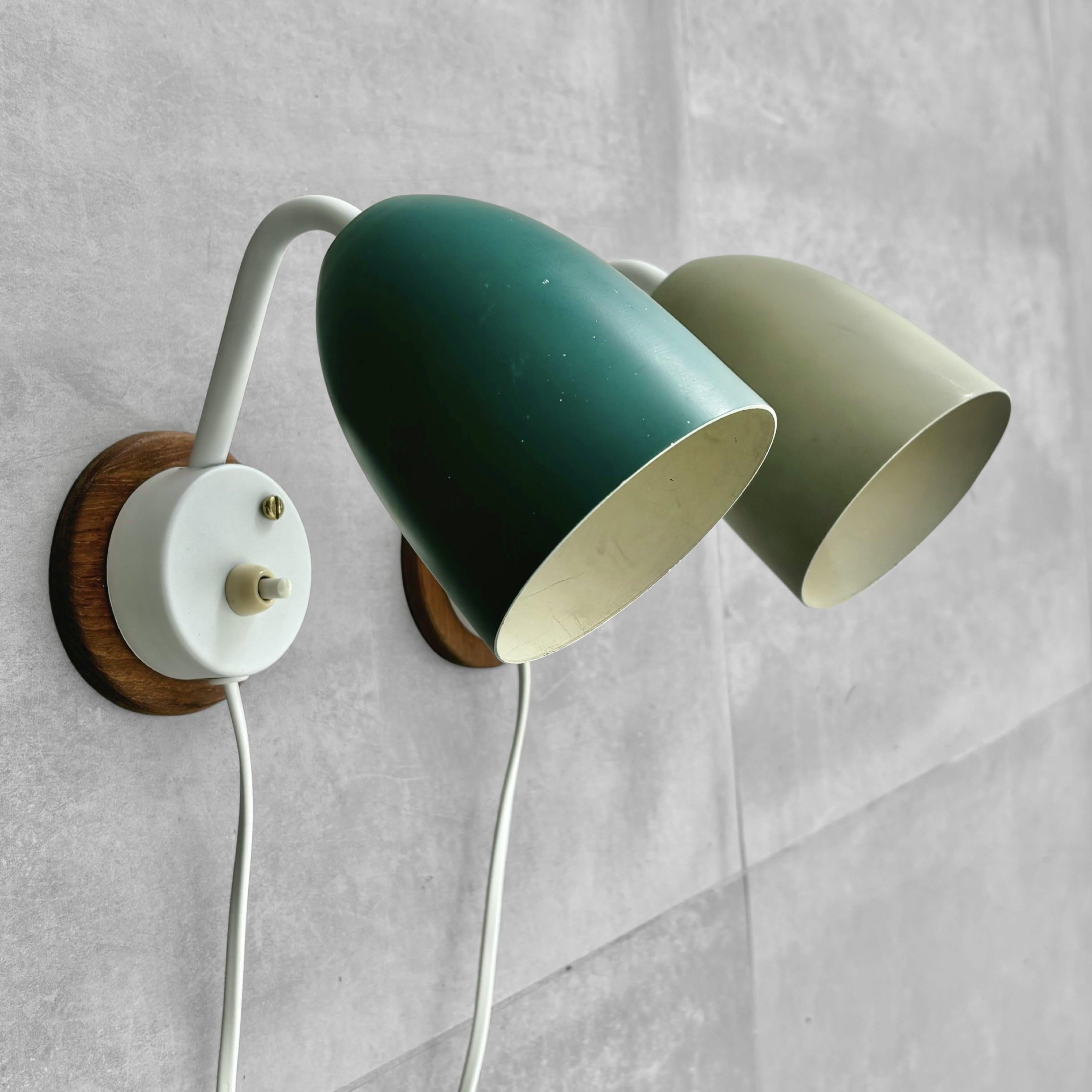 Swedish A pair of modernist Scandinavian wall lamps, steel and oak, Sweden, 1950s For Sale