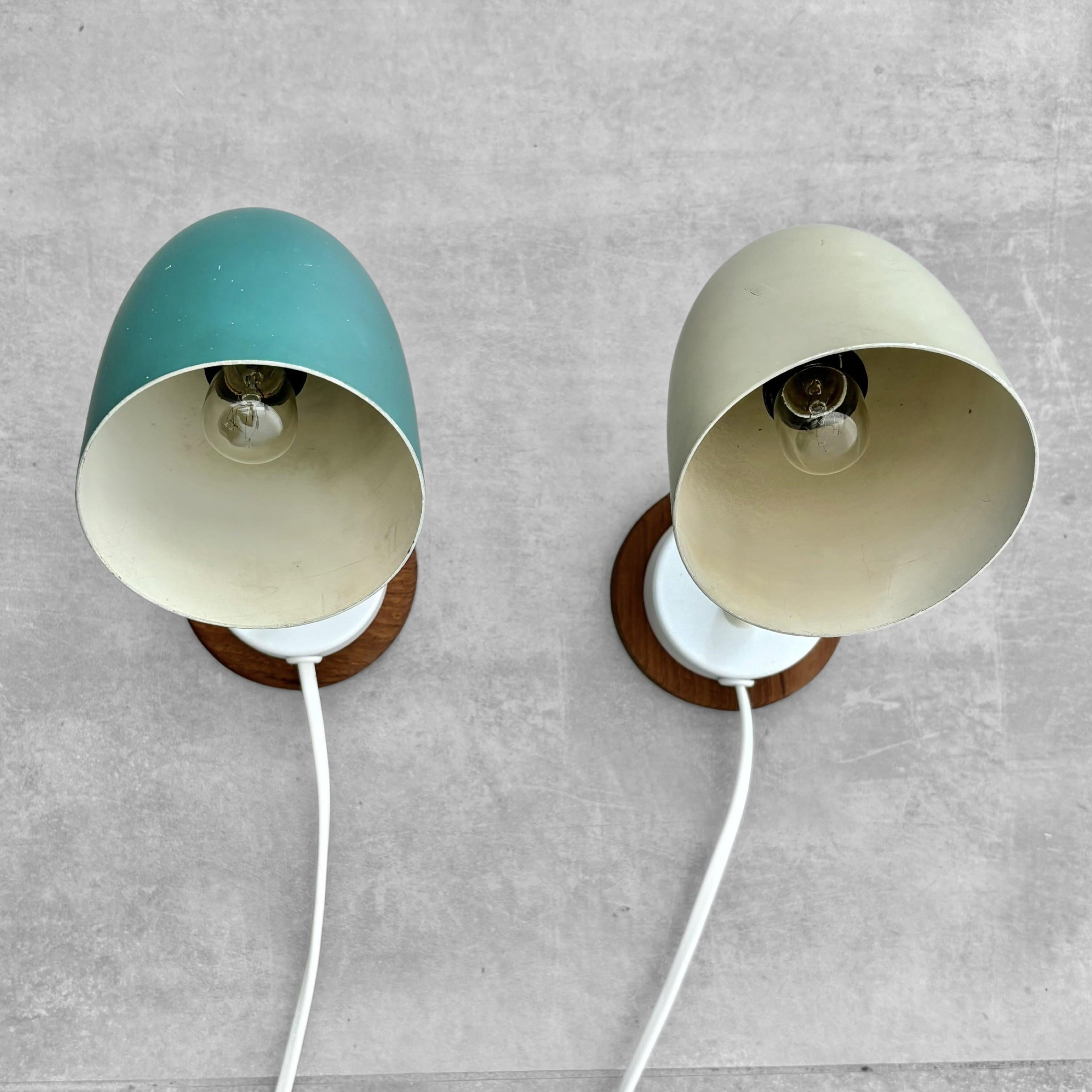 Mid-20th Century A pair of modernist Scandinavian wall lamps, steel and oak, Sweden, 1950s For Sale