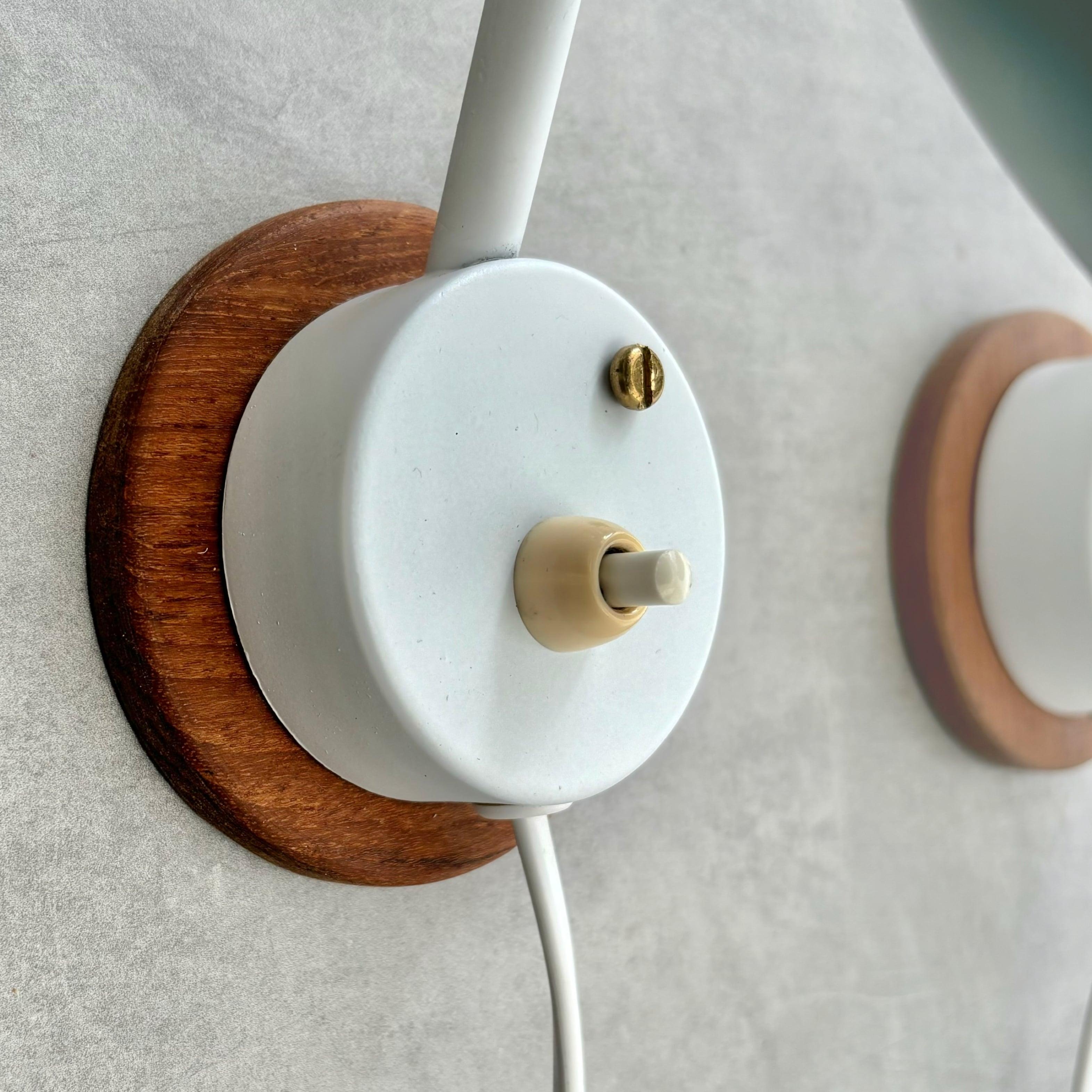 A pair of modernist Scandinavian wall lamps, steel and oak, Sweden, 1950s For Sale 1