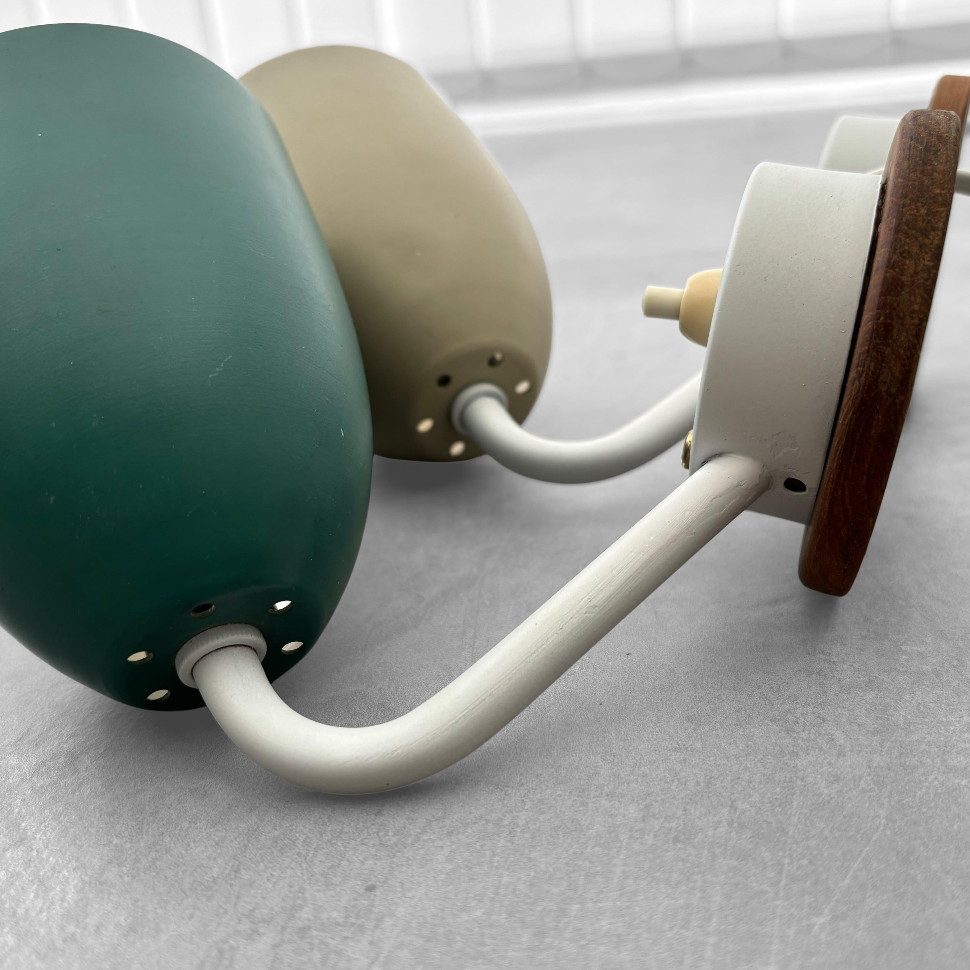 A pair of modernist Scandinavian wall lamps, steel and oak, Sweden, 1950s For Sale 2