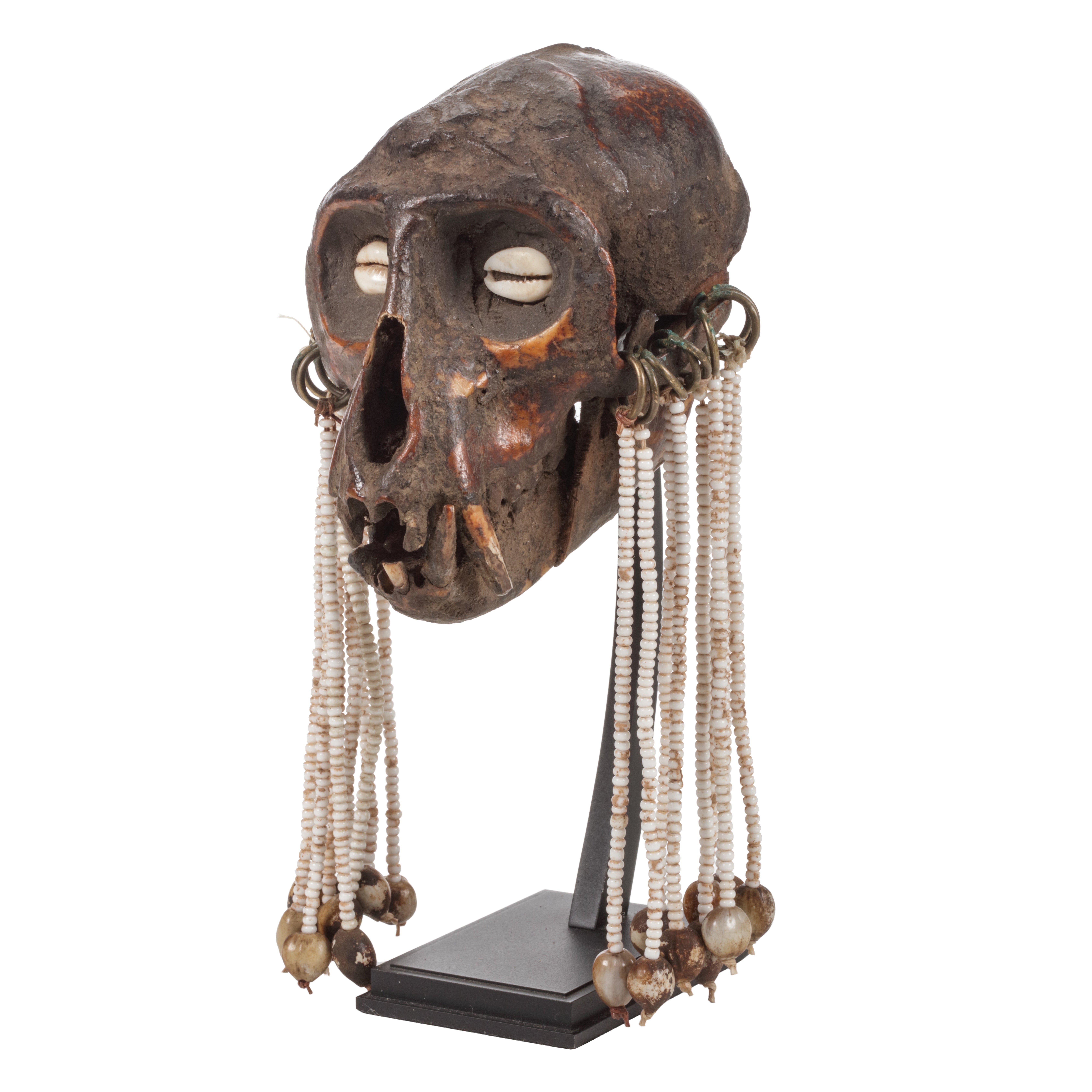 A pair of monkey skull amulets For Sale