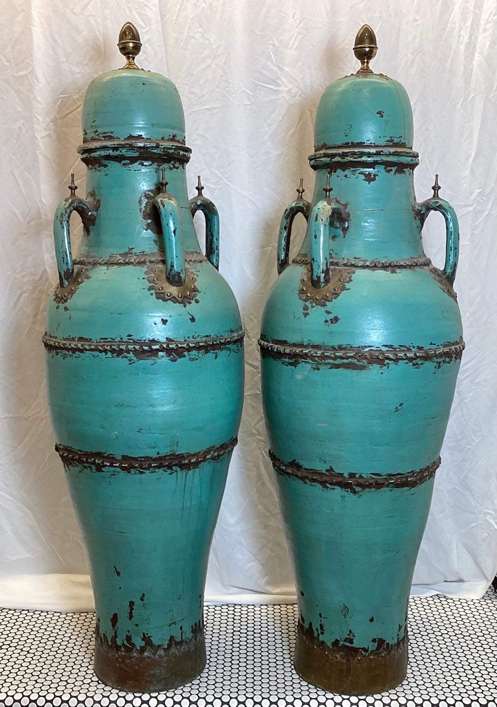 A Pair of Monumental Four Handled Tall Pottery Urns For Sale at 1stDibs