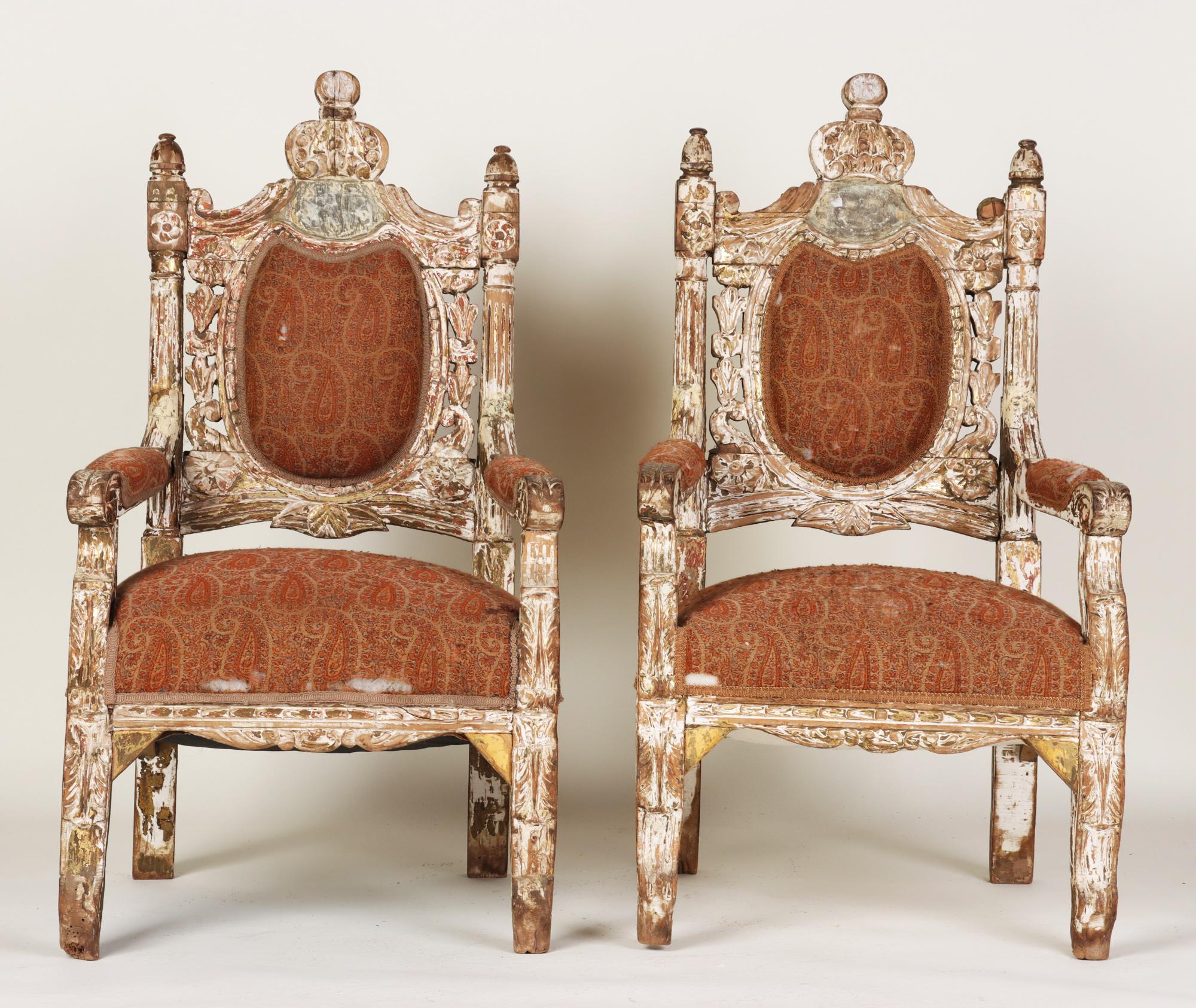 A pair of monumental Italian throne style carved armchairs. Early 19th C. Gilding mixed with a natural cerused oak look give these chairs a beautiful patina. Having original horsehair upholstery still intact.