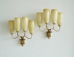 A pair of monumental wall lights  by Paavo Tynell for Taito Oy