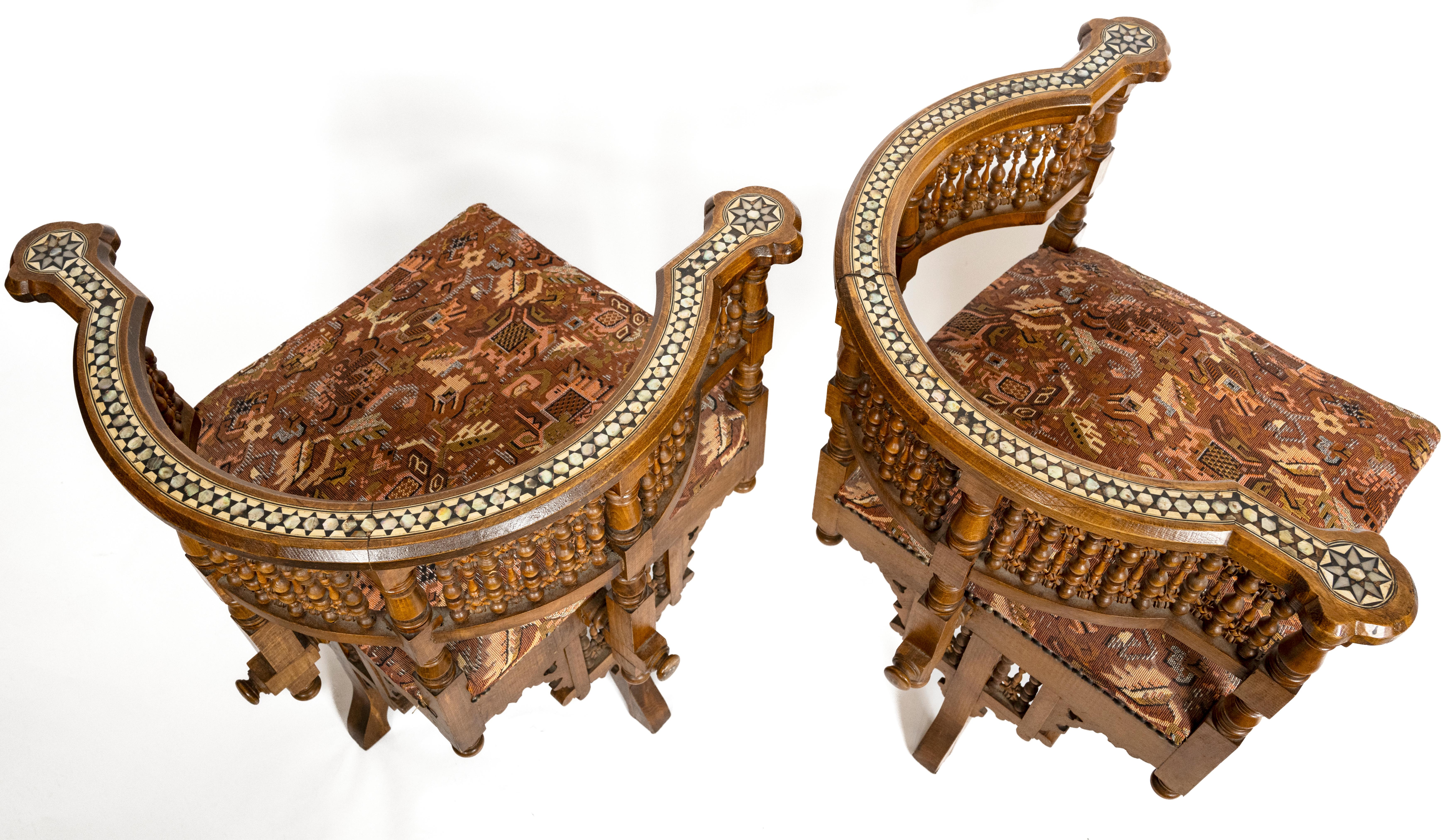 A pair of 19th century Moorish-style American maple open arm chairs. The mother of pearl inlay around the top and legs with a star motif. The back having traditional North African-inspired fretwork. Circa 1870.

Seat Depth: 25.5