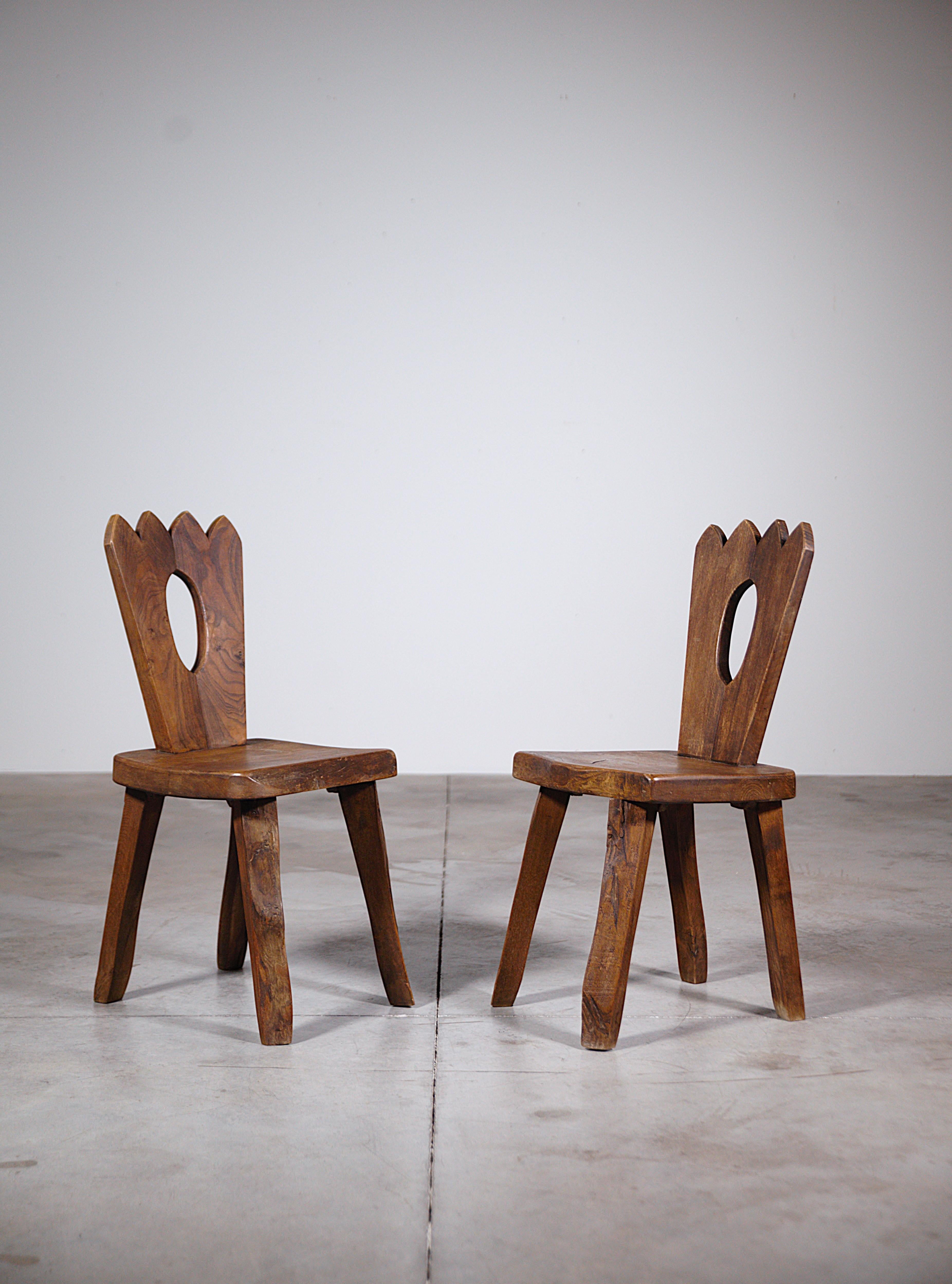 A Pair of  Mountain Dining Chairs by Aranjou France 1970's

In solid elmwood.

Quality manufacturing and nice patina.

In good condition.