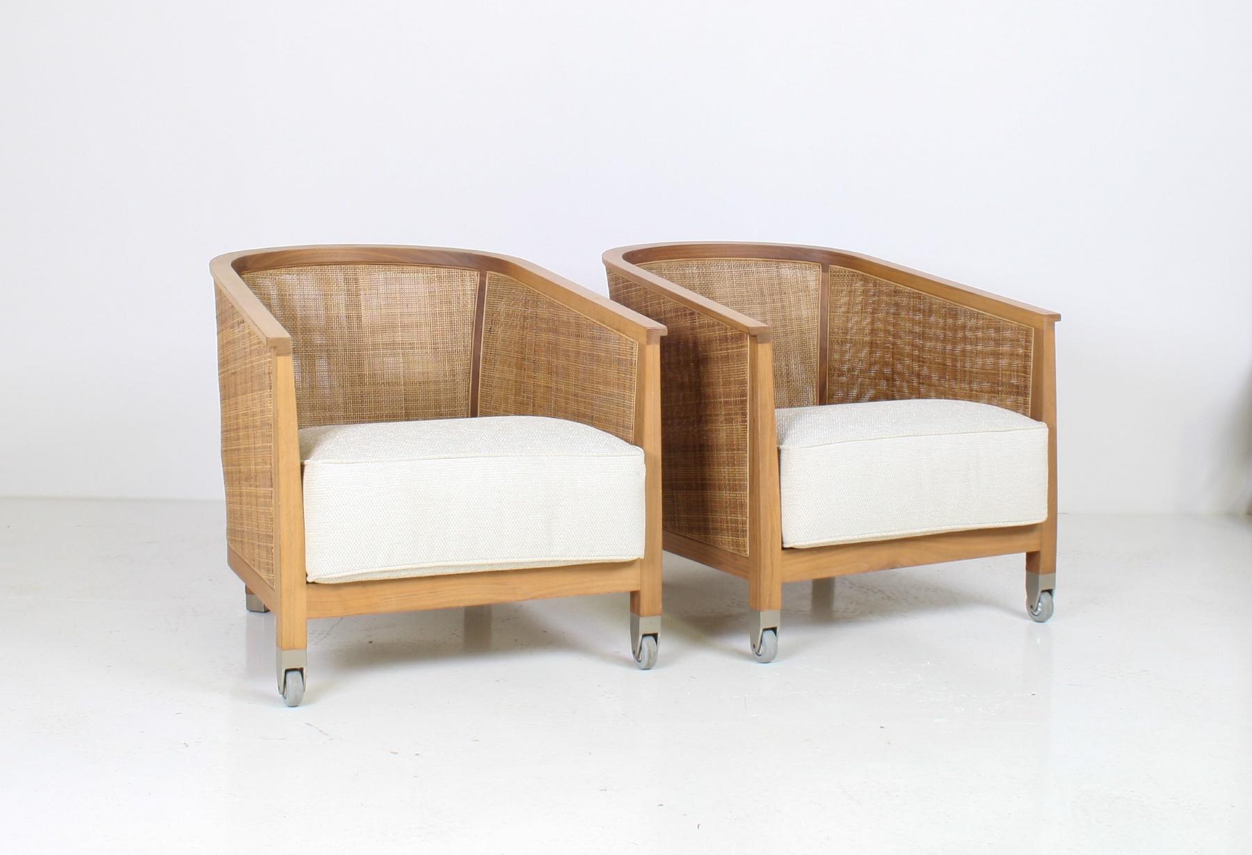 A pair of ‘Mozart’ woven reed/rattan armchairs by high-end Italian manufacturer Flexform.
A refined interior armchair, the Mozart chair exudes an outdoor charm and vague recollections of colonial times. Its light but sturdy metal and wood structure