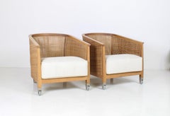 A pair of ‘Mozart’ Woven Rattan Italian Lounge Armchairs By Flexform