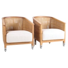 A pair of ‘Mozart’ Woven Rattan Italian Lounge Armchairs By Flexform