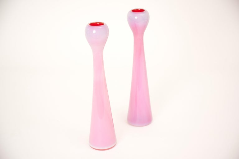 A pair of elegant milky pink/white candlesticks with an almost red contrasting centre

Produced in Murano in the 1960s by Barovier & Toso. 

Original label present. (See images).