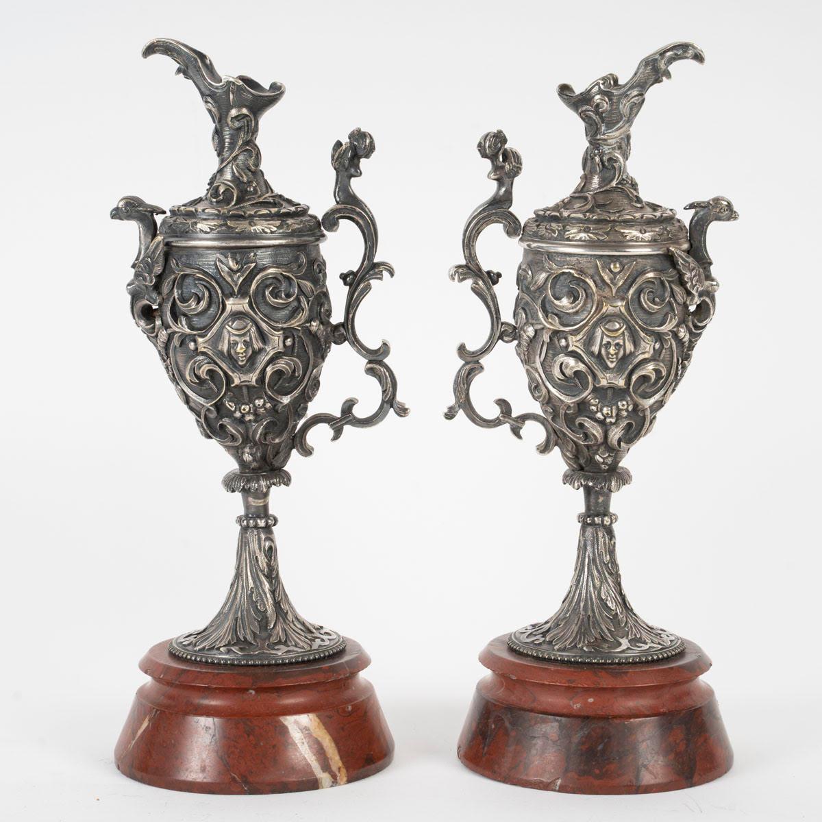 A pair of Napoleon III period silvered bronze ewers with griotte marble bases.

A pair of Napoleon III period ewers, 19th century, in silvered bronze with a griotte marble base.
h: 26.5cm, w: 12cm, d: 10cm