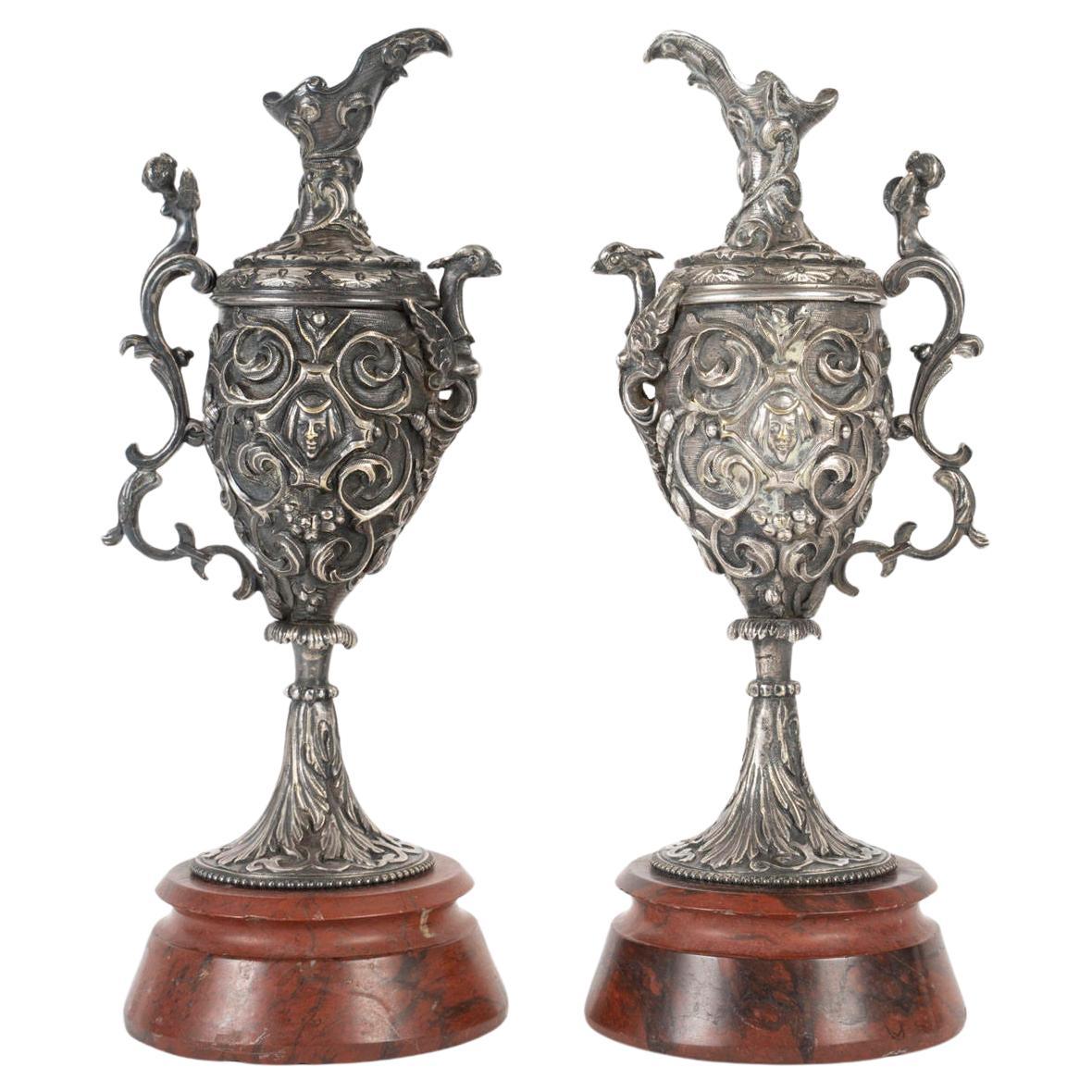 A pair of Napoleon III Period Silvered Bronze Ewers with Griotte Marble Bases. For Sale