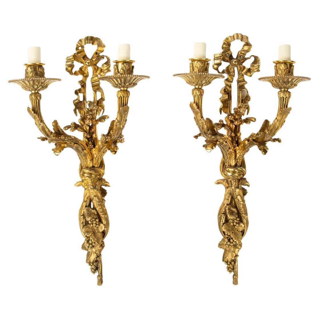 A pair of Napoleon III two-branch ormolu wall lights For Sale