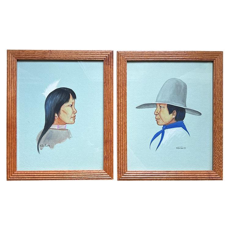 A pair of Native American Framed Paintings of Man and Woman - Signed Jon Tiger