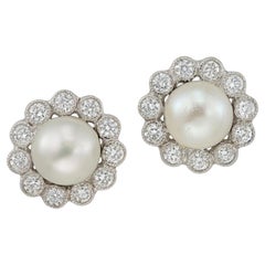 A Pair Of Natural Pearl And Diamond Cluster Earrings
