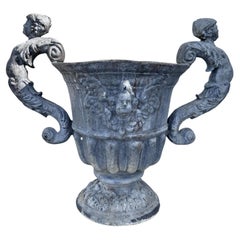 A Pair of Neoclassical Lead Urns Planters