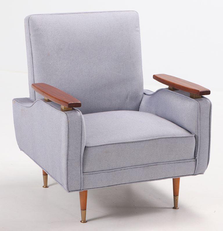 A pair of newly upholstered lounge chairs with floating arms in the manner of Finn Juhl, circa 1950.
