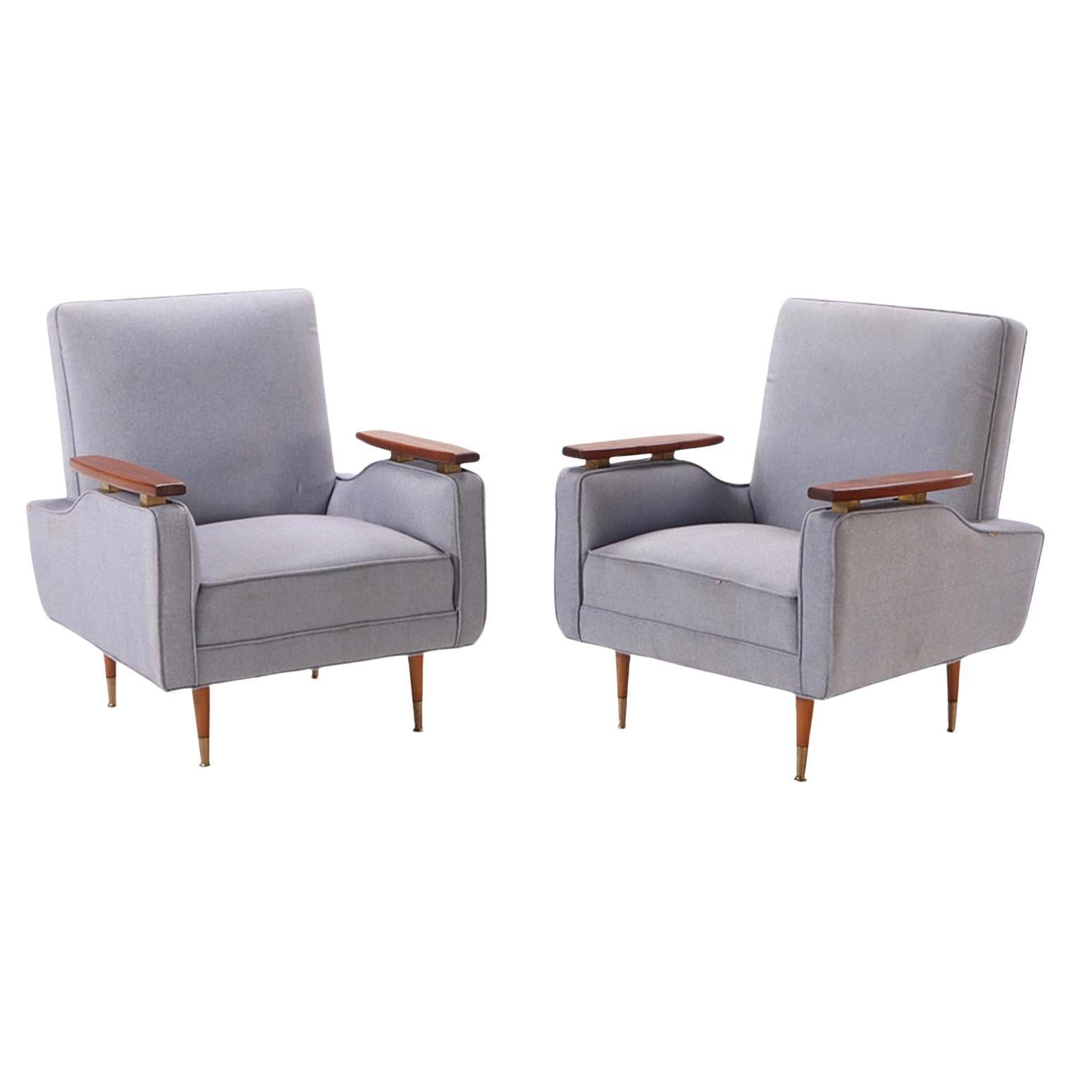 A pair of newly upholstered lounge chairs in the manner of Finn Juhl circa 1950.