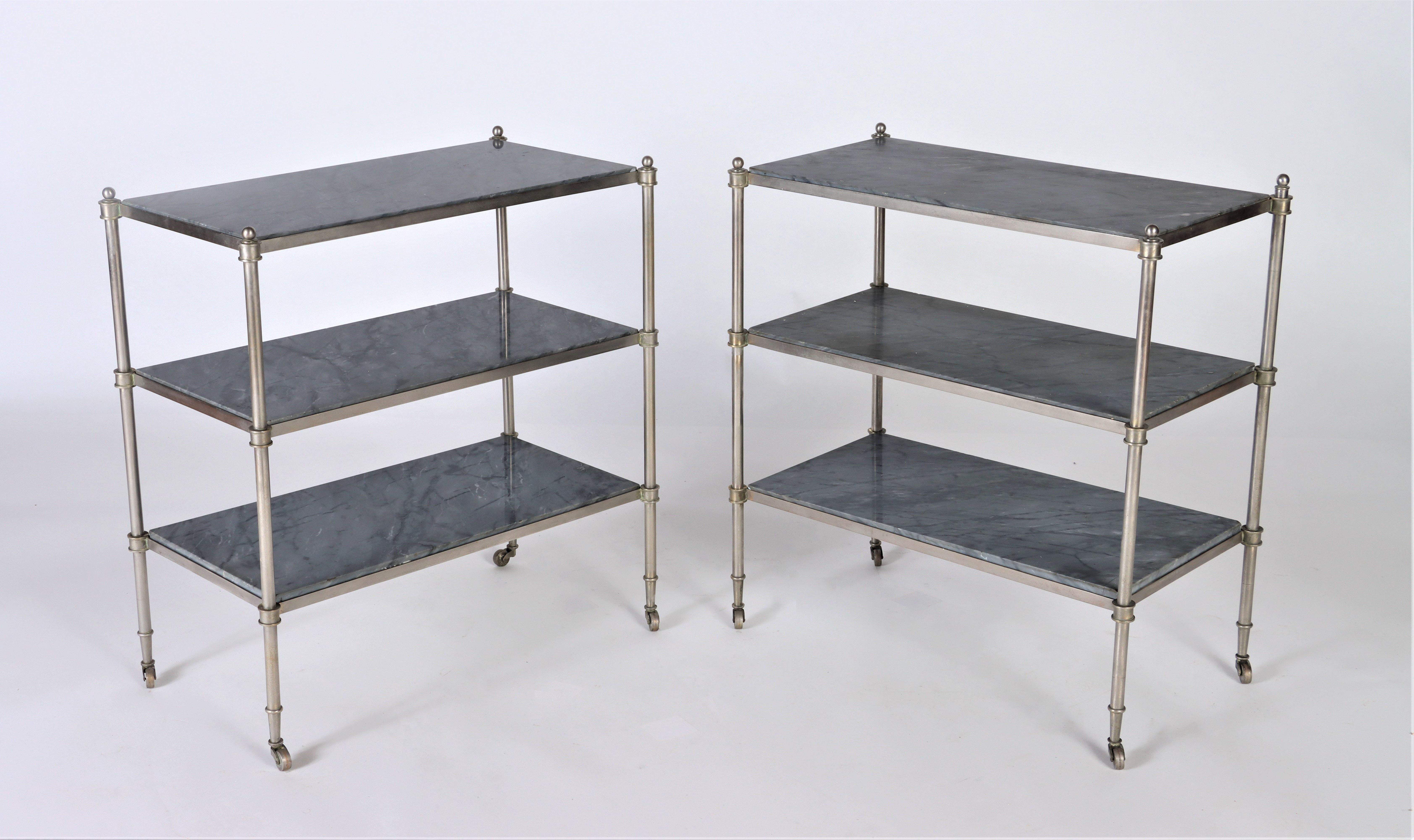 A rare pair of nickel over bronze French three tier tables with blue grey marble circa 1940. In the manner of Jansen.