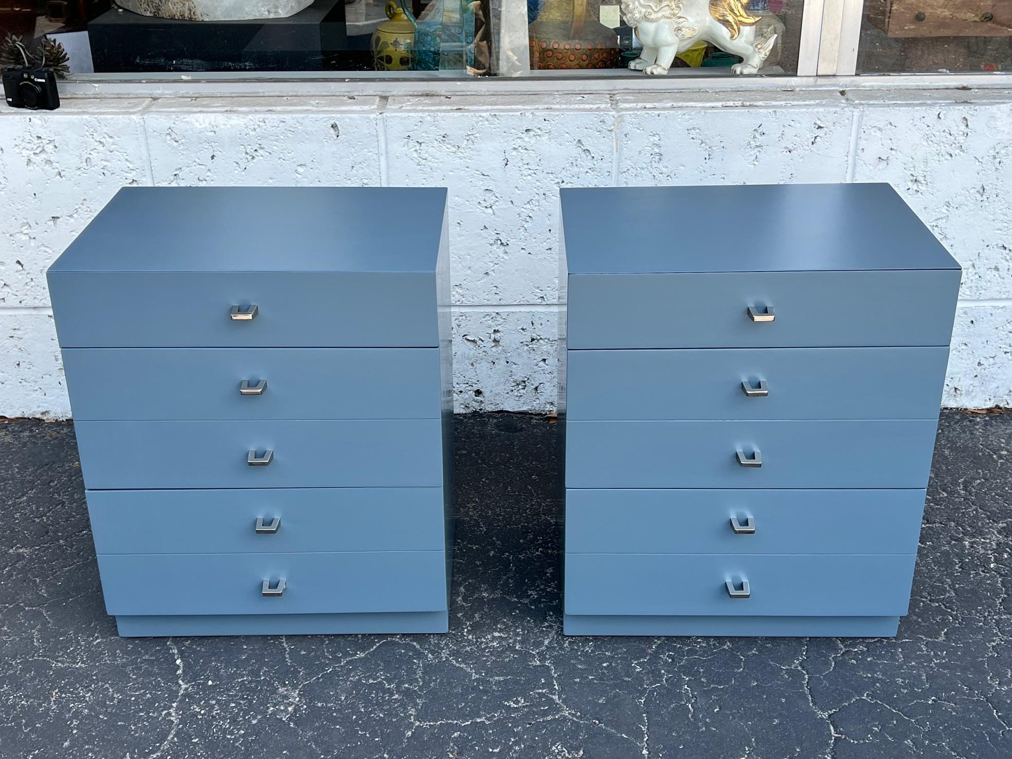 A fine pair of night stands or small chests of drawers by American of Martinsville. Ca' 1960's, with three drawers each. Reconditioned and redone in blue gray lacquer, handles polished/lacquered.