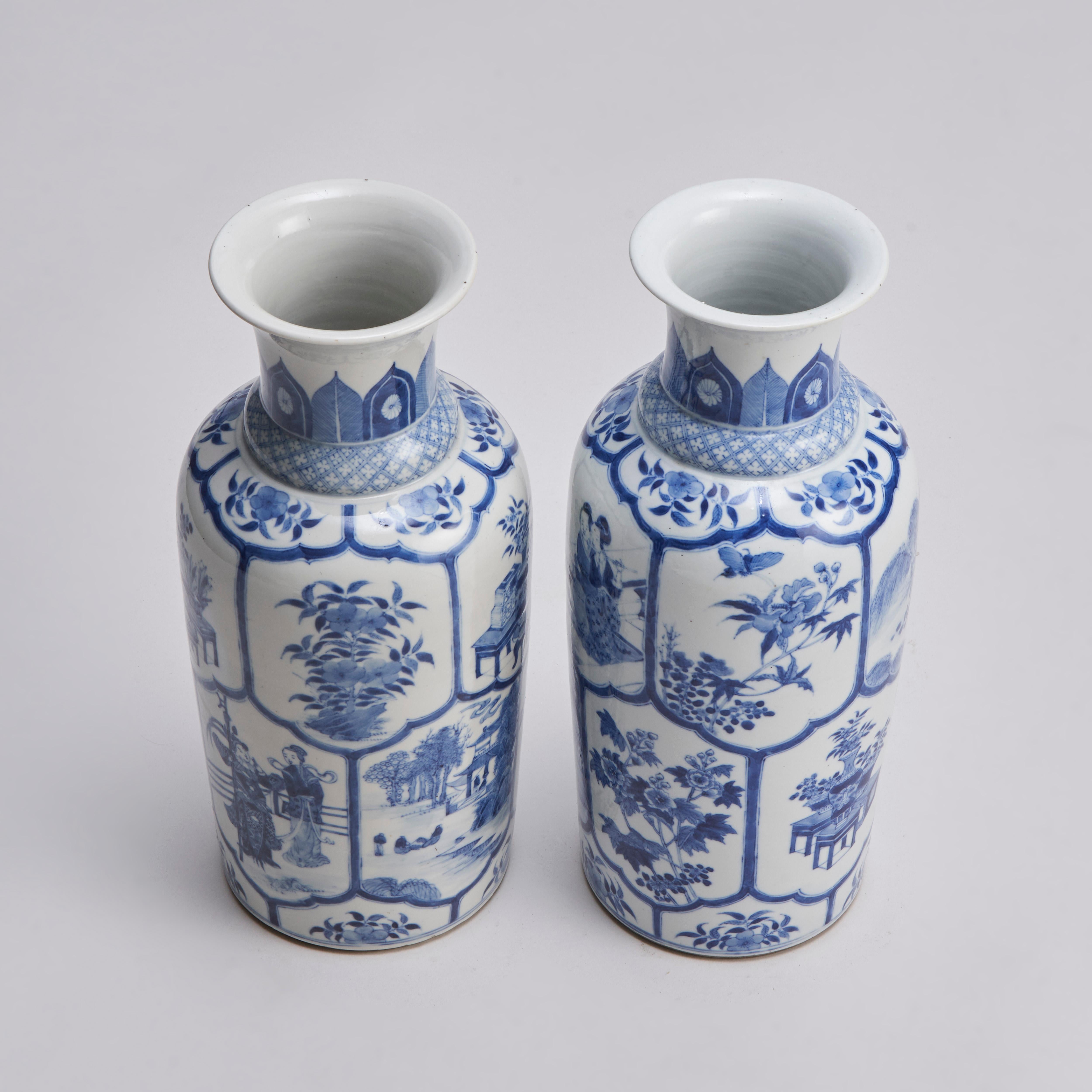 From our collection of antique Chinese porcelain, a pair of 19th century Chinese blue and white vases with an interlocking desing of many panels depicting flowering shrubs and insects, courtly ladies at leisure, flower displays and a Han Dynasty