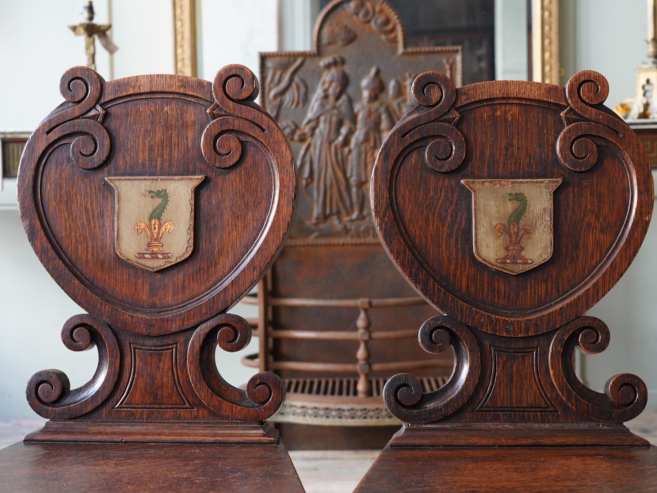 Pair of Oak Armorial Hall Chairs 1