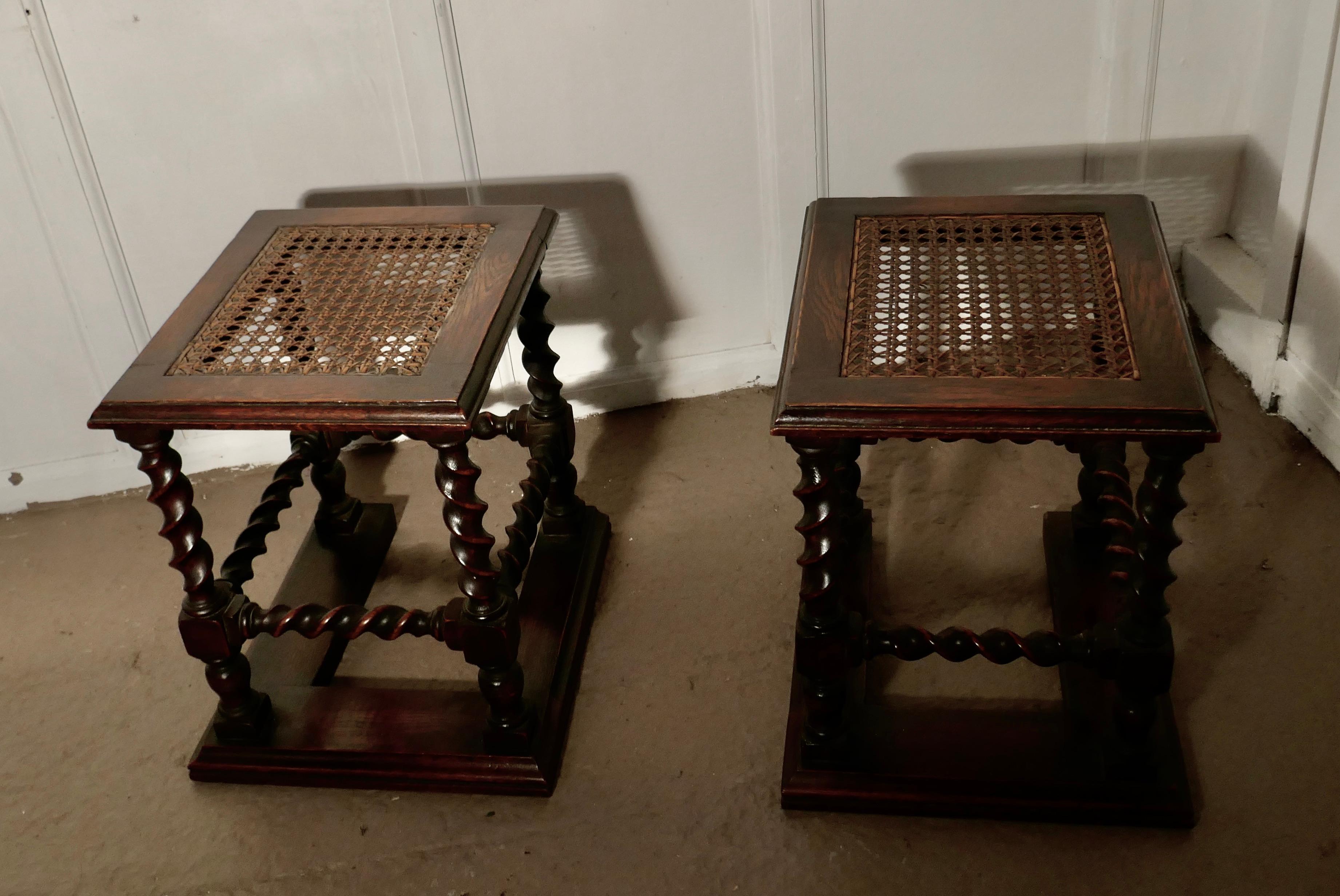 A pair of oak barley-twist and bergère fireside stools

A very attractive pair of stools, they have oak barley-twist turned legs and stretchers
They sit on a broad oak plinth making them very steady and have a bergère woven panel seat
The stools