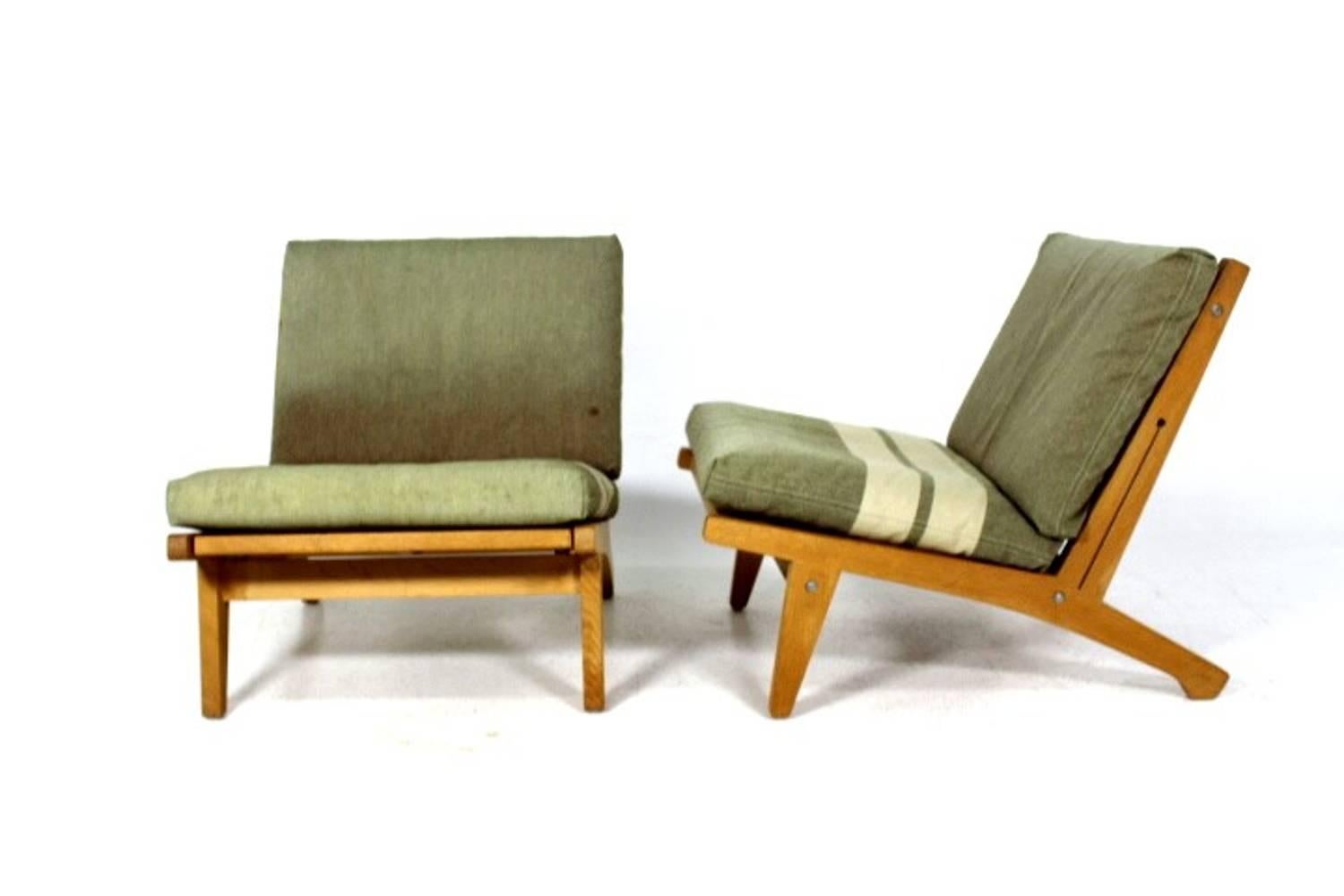 A pair of oak lounge chairs 