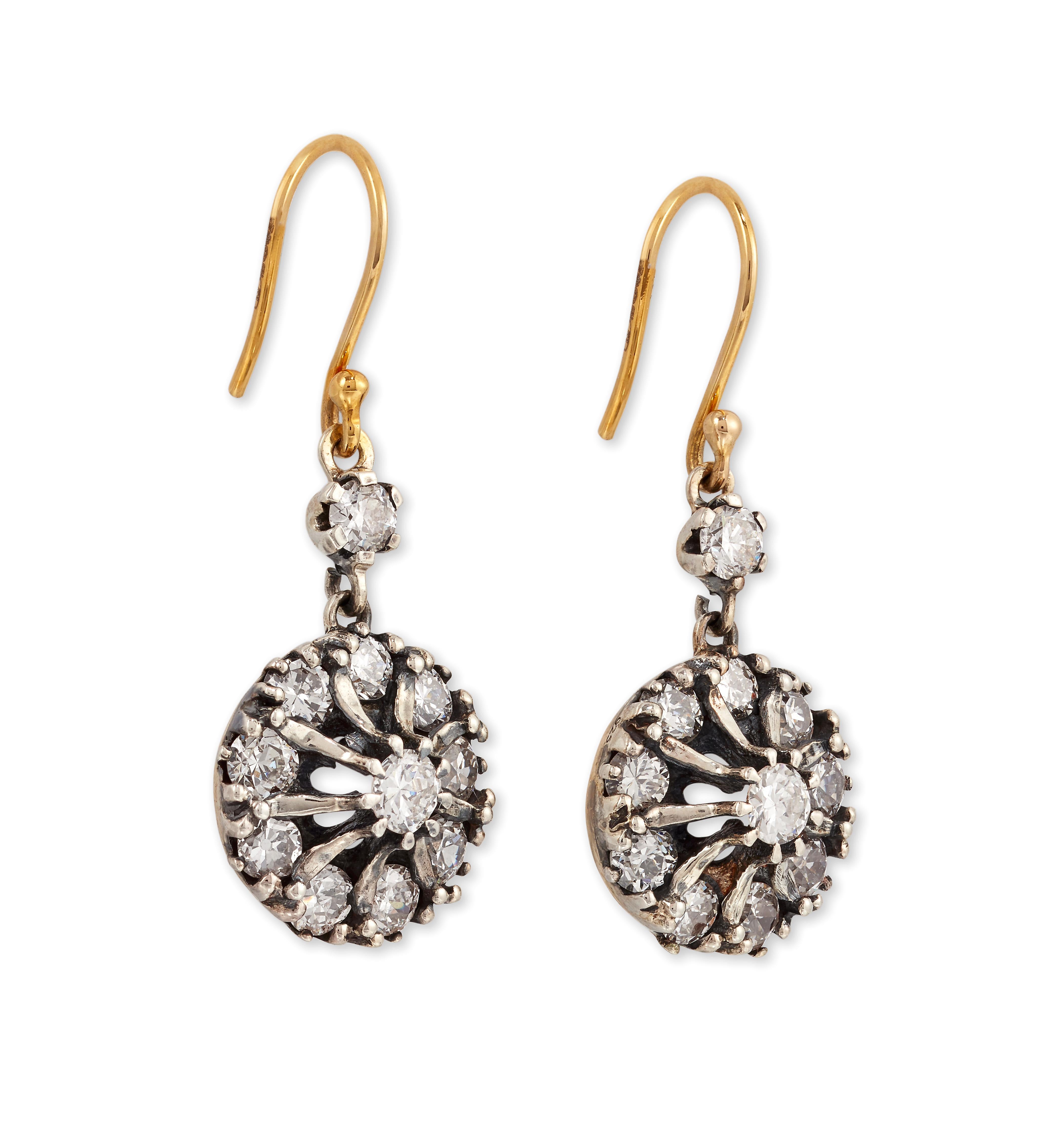 Beautiful pair of old-cut Diamond circular cluster earrings, suspended from a single-stone surmount, to hook fittings.

Mounted in 18ct yellow gold and Silver 