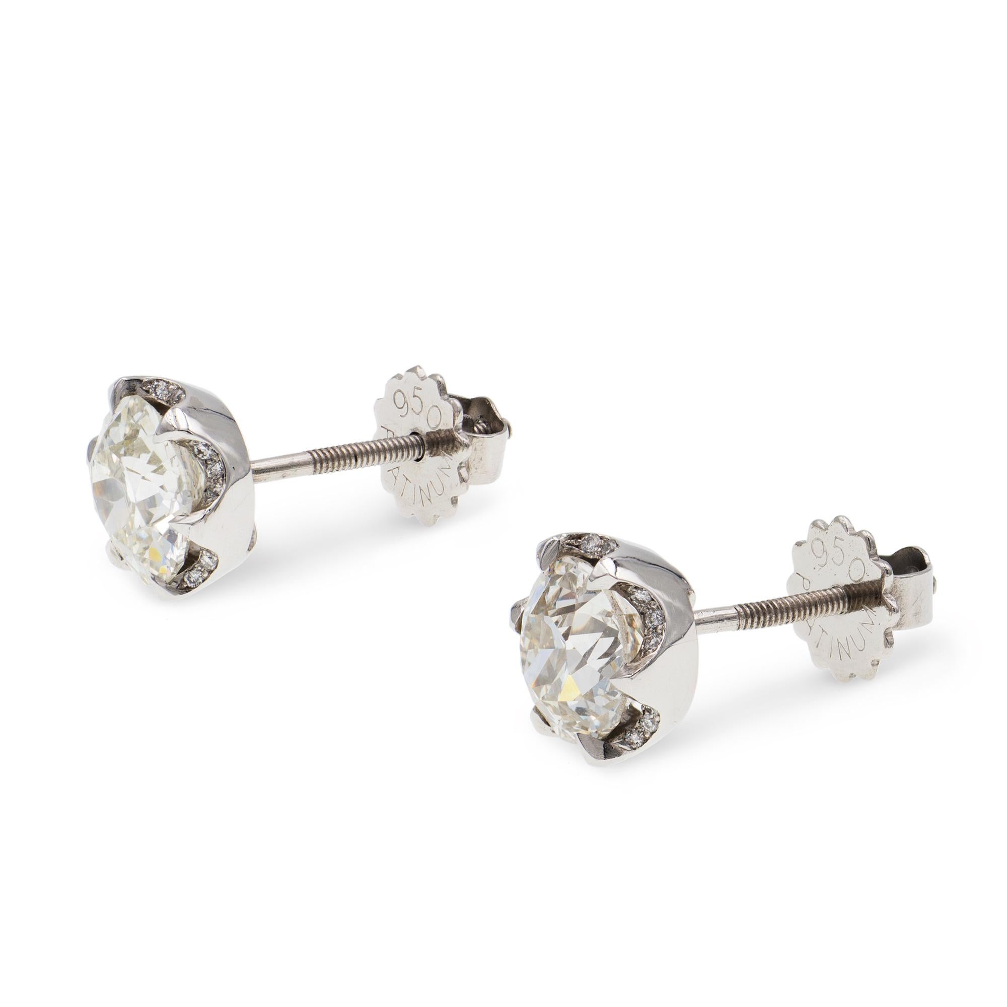 A pair of old-cut diamond stud earrings, the one earring set with a 1.23ct old-cut diamond, of J colour VS2 clarity, the other set with an old cut diamond weighing 1.11 carats, J colour VVS2 clarity, accompanied by HRD reports, mounted in a claw