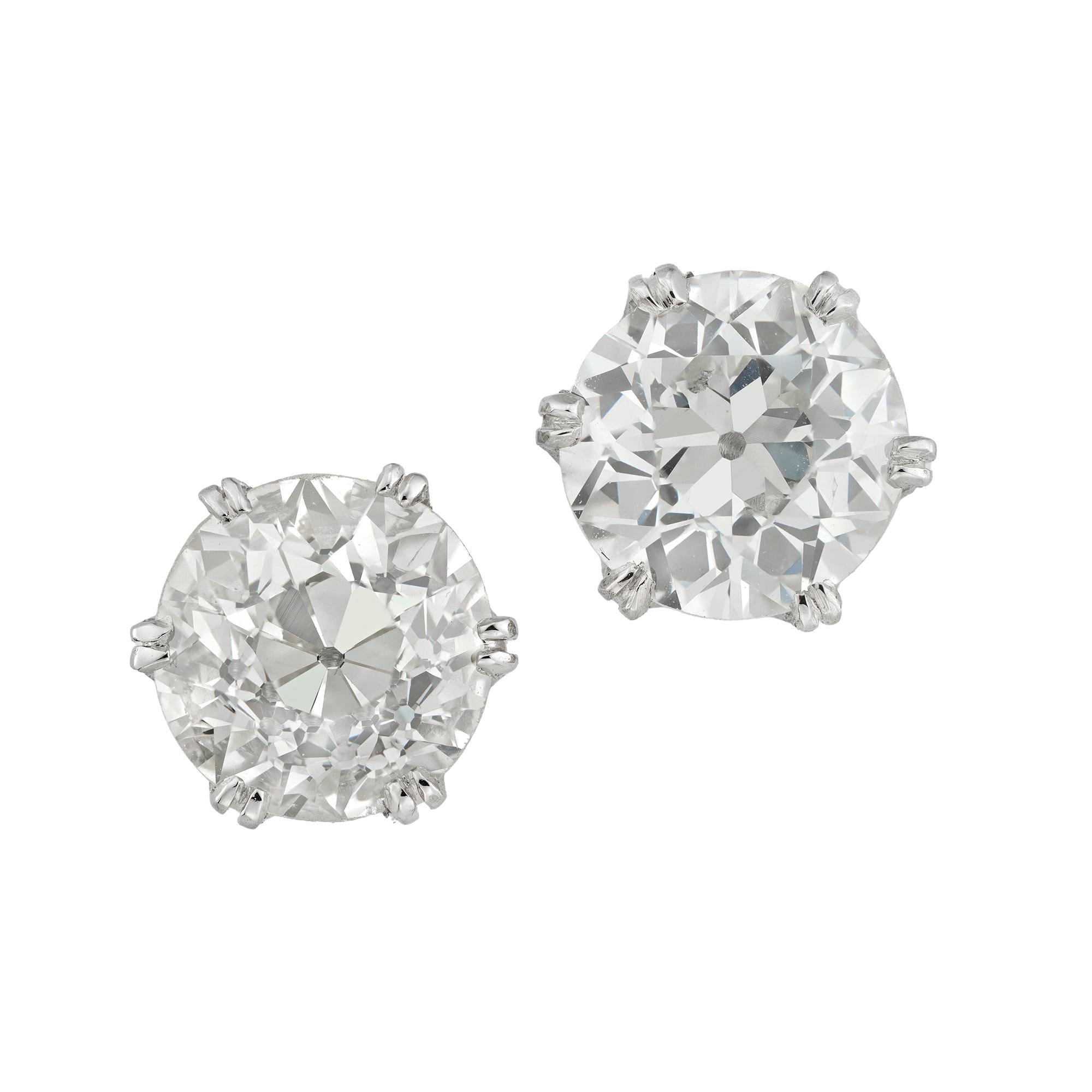 A pair of old-cut diamond stud earrings, the one old European-cut diamond weighing 1.71 carats of M colour and VS2 clarity, accompanied by GCS report, the other weighing 1.52 carats of K colour and SI1 clarity, accompanied by De Beers report, each