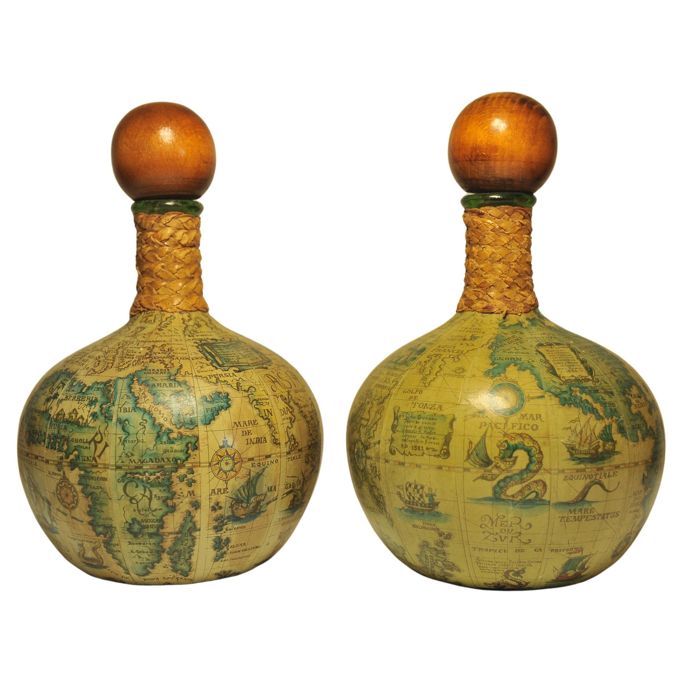 A Pair Of Old World Map Decanters With Wooden Stoppers & Leather Neck Bindings