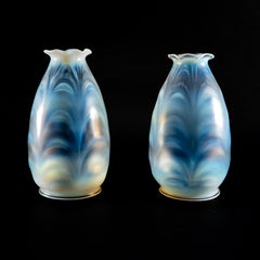 A Pair of Opalescent Glass Shades with Striking Feathered Patterns