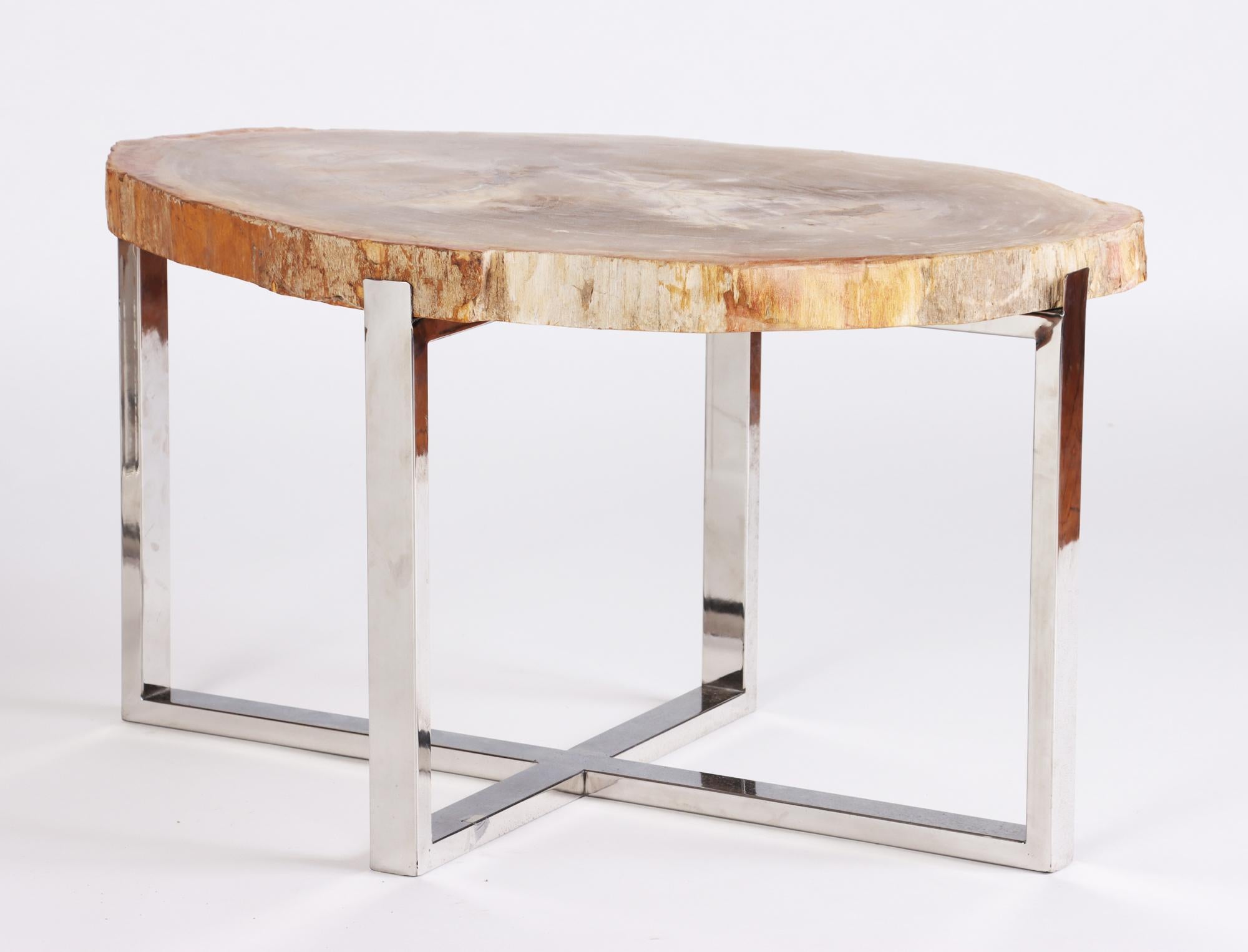 A pair of organic Modern petrified wood side tables on modern chrome bases, 21st C.