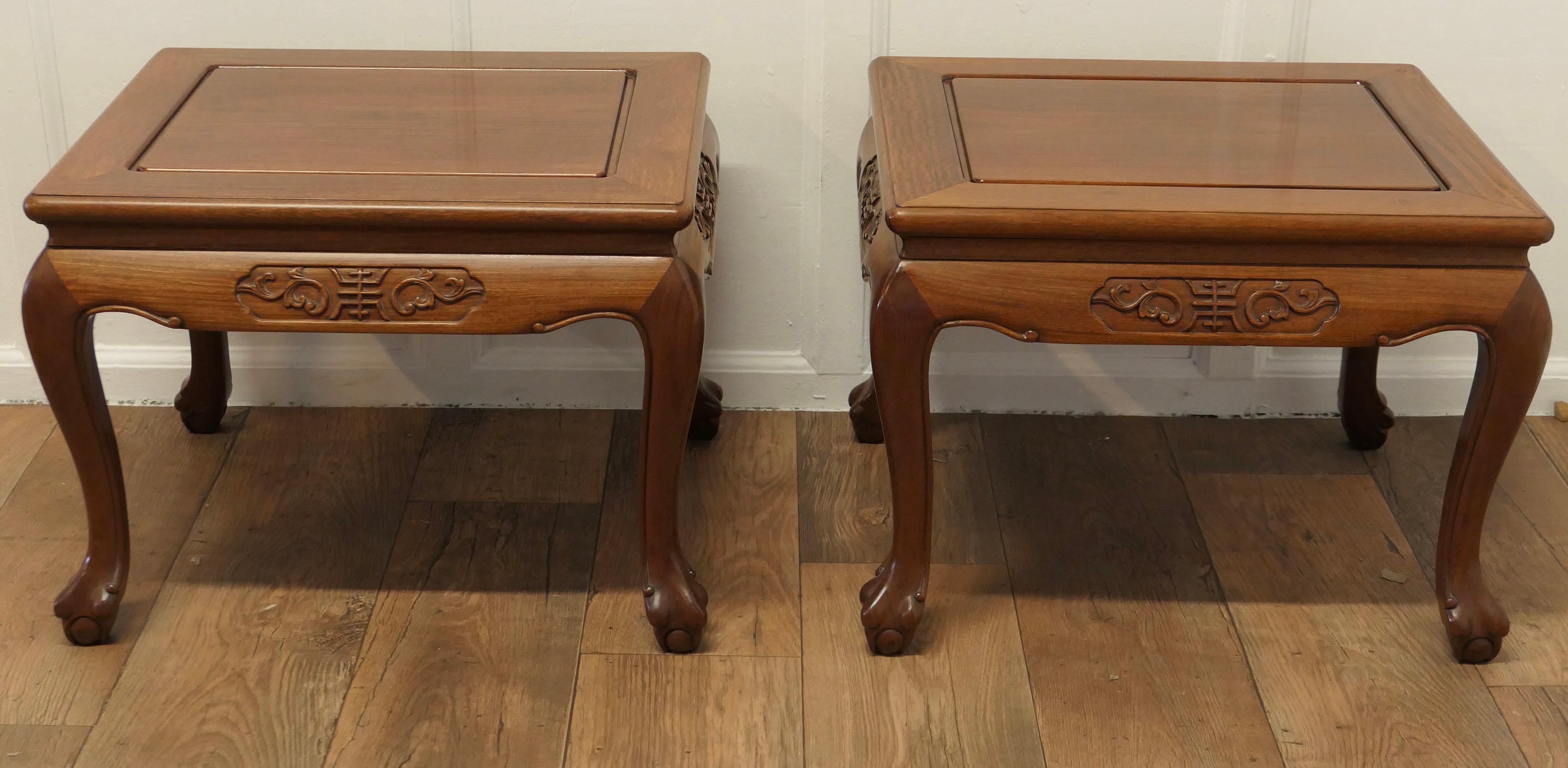 A Pair of Oriental Teak Low Tables, Coffee Tables

This is a very attractive pair, the tables stand on Carved cabriole legs with decorative carving around the aprons
The tables are good and sound with a good patina, they would work well as either
