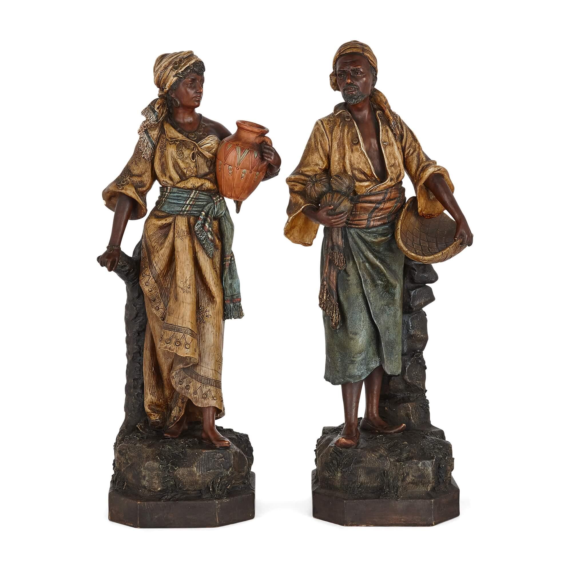 A pair of Orientalist terracotta figures by Johann Maresch
Austrian, Late 19th Century
Man: height 49cm, width 20cm, depth 15cm
Woman: height 48cm, width 20cm, depth 15cm

Depicting a woman and a man of similar appearance, age, dress, and in a