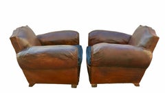A pair of original Art Deco French Moustache leather club chairs. France 1930
