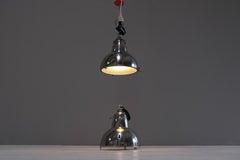 A pair of original, french industrial lamps, restored, ca. 1040s