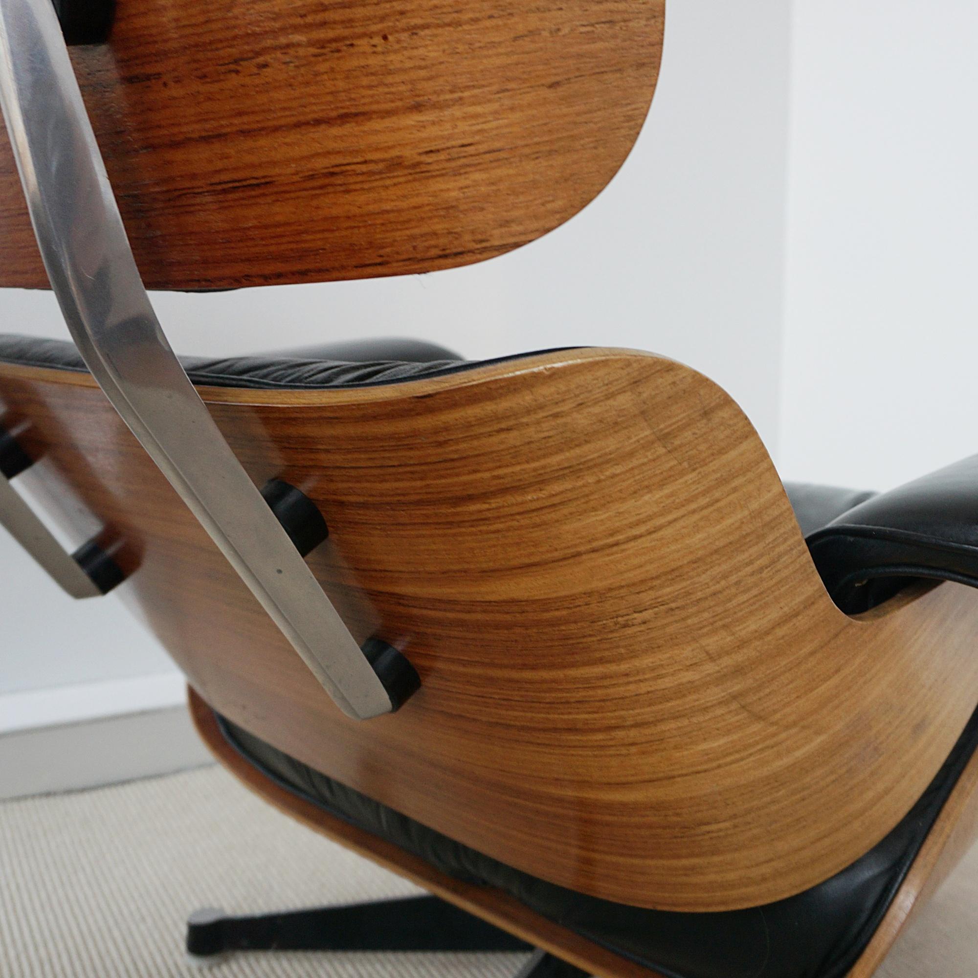 Leather A Pair of Original Herman Miller Eames Chairs and Ottoman for Hille