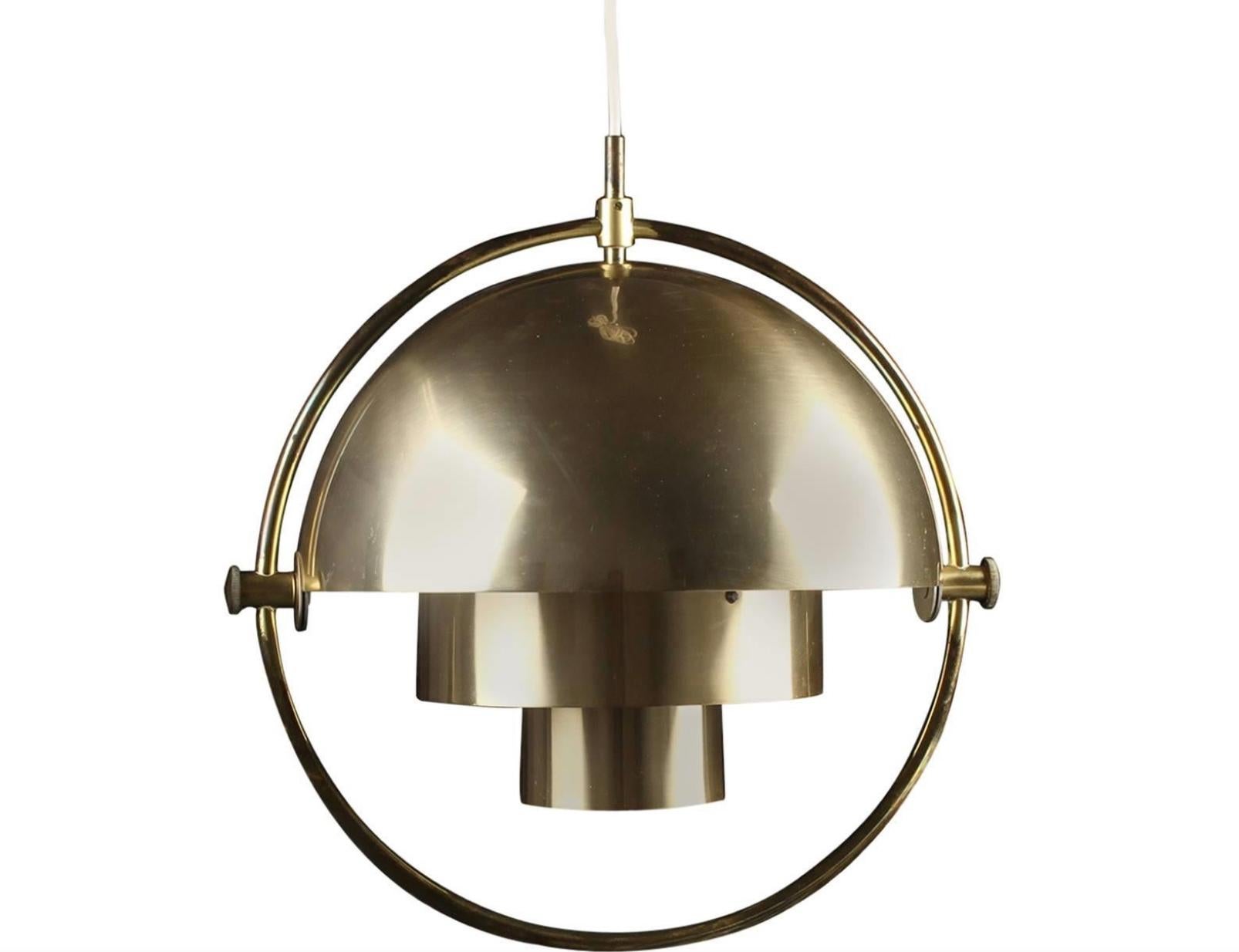 A pair of original Multi-Light Pendant by Louis Weisdorf for Lyfa. Denmark, circa 1970th. Brass plated metal. Lights scratches.
The fixtures must be rewire prior otherwise use.
Rewiring available upon request.