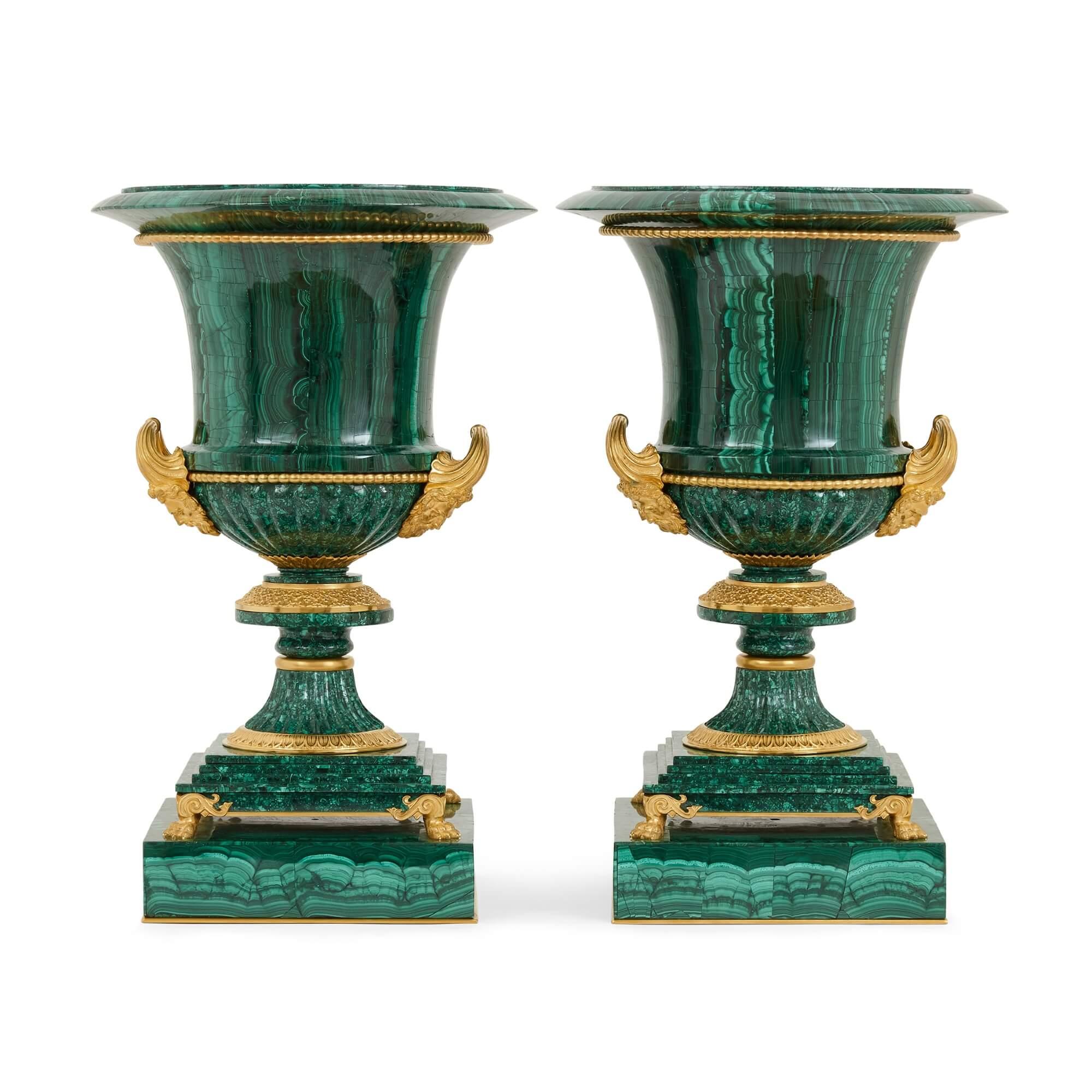 A pair of ormolu mounted malachite Ekaterinburg vases after a design by I.I. Galberg
French, 20th century
Height 51cm, diameter 32cm

Crafted to a design by the prestigious architect and craftsman Ivan Ivanovich Galberg, the Imperial Court architect