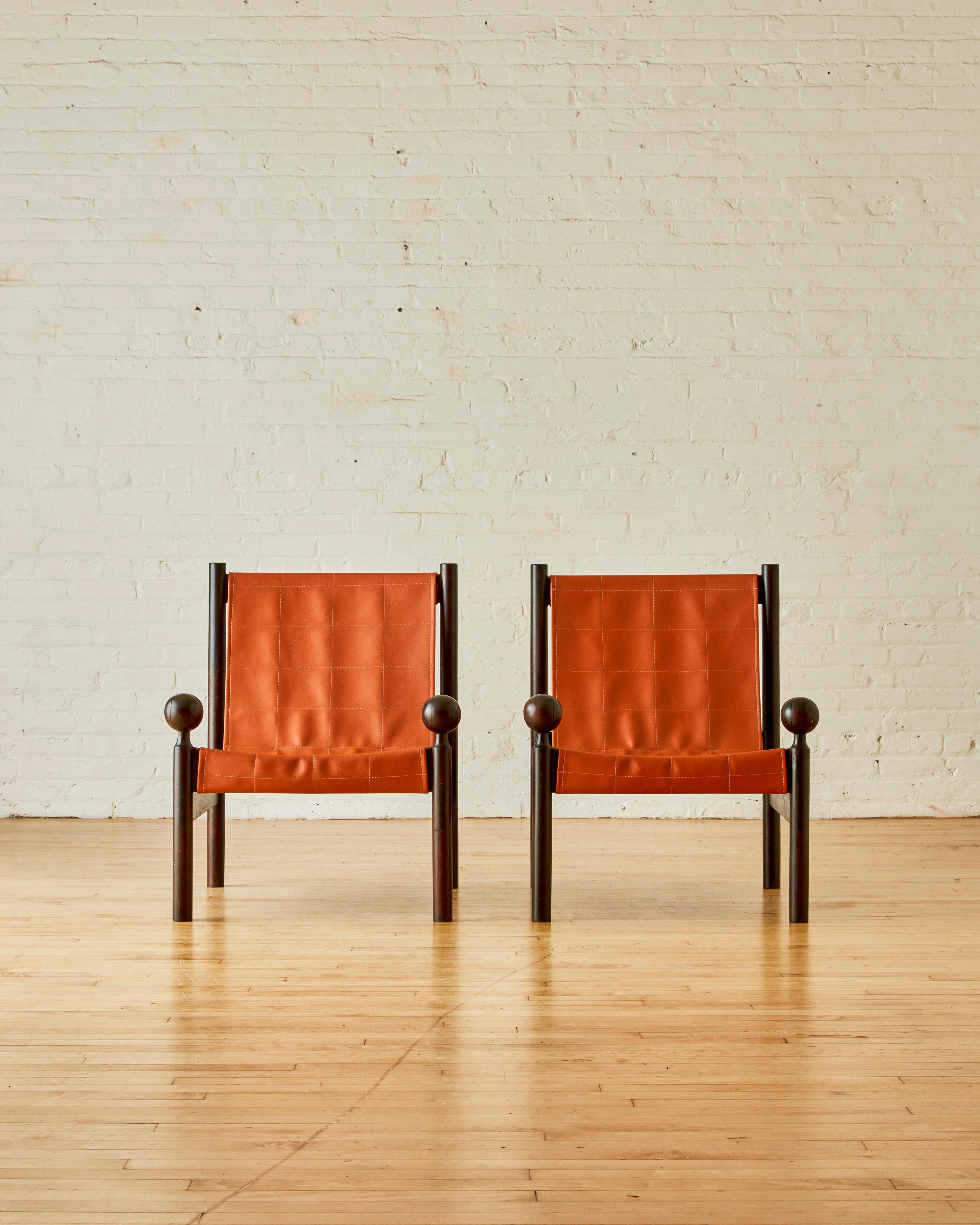 A pair of Ouro Petro lounge chairs by Jorge Zalszupin with a rosewood frame and orange leather upholstery.

Jorge Zalszupin founded L’Atelier, a furniture design company, in São Paulo in the late 1950s. The company became known for its innovative